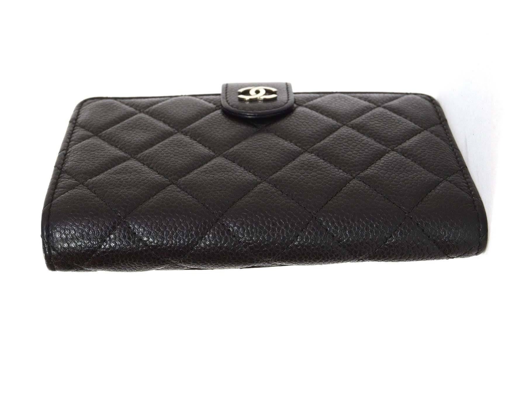 Chanel Black Caviar L-Zip Pocket Zip Wallet
Features CC logo push button closure
Made in: Italy
Year of Production: 2012
Color: Black 
Hardware: Silvertone
Materials: Caviar leather
Lining: Burgundy leather
Closure/opening: Bi fold with