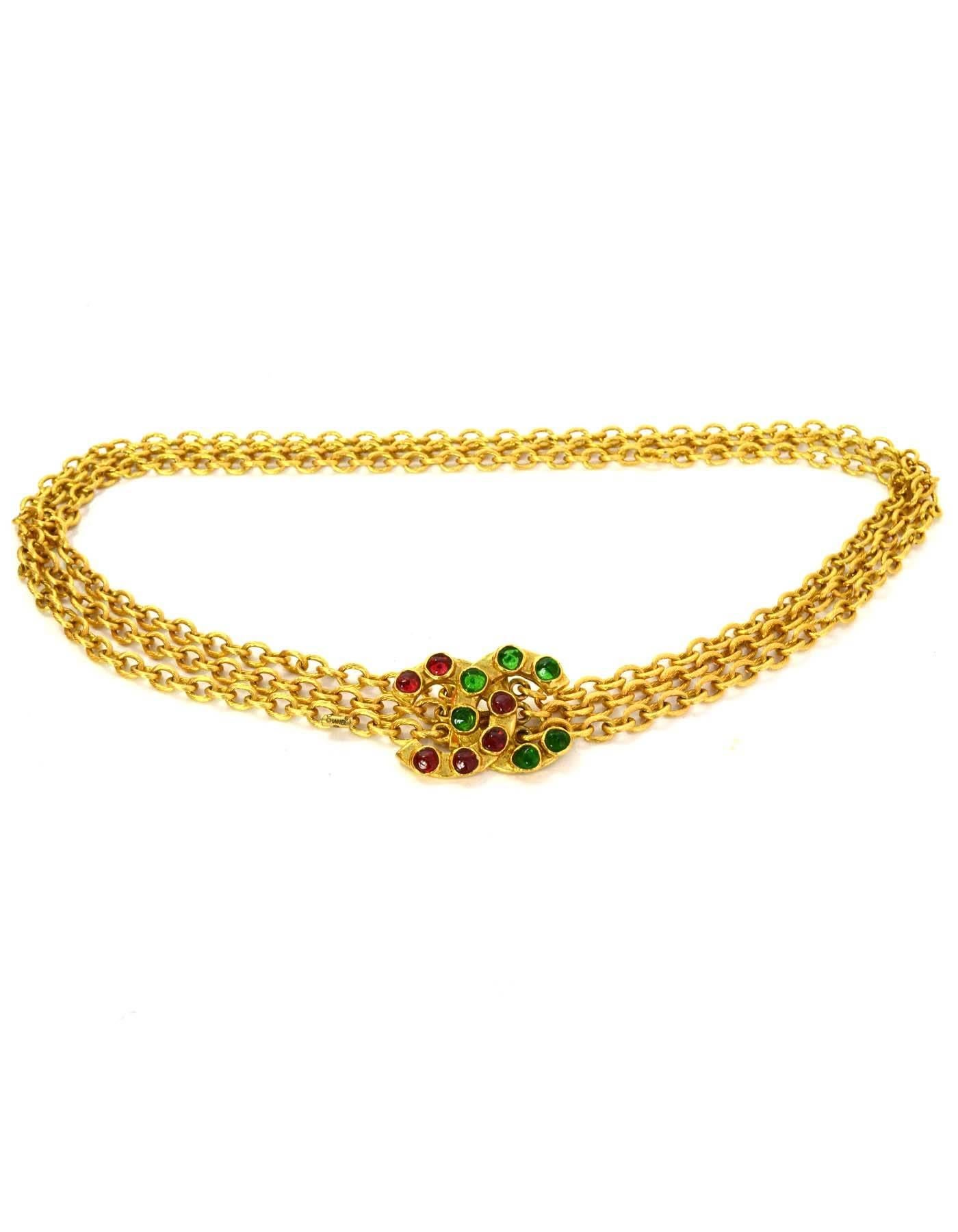 Chanel Vintage ''80s Gripoix & Gold Multi-Strand Belt/Necklace
Features three strands of goldtone chain link metal with green and red gripoix glass CC buckle
Year of Production:1980's
Color: Goldtone, red and green
Materials: Metal and poured