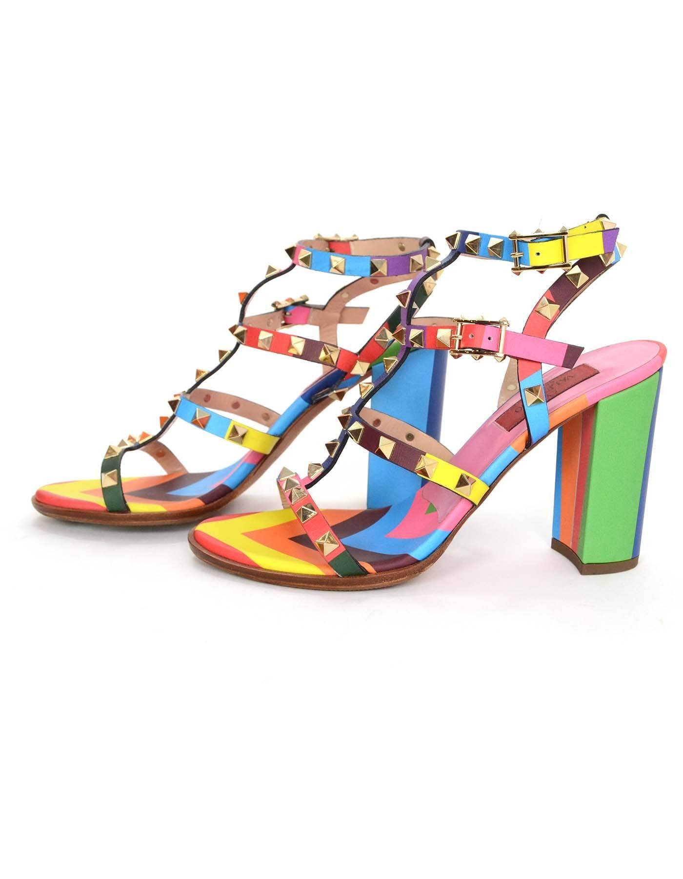 Valentino Rainbow Leather Rockstud City Sandals 
Made In: Italy
Color: Multi-colored
Hardware: Goldtone
Materials: Leather and metal
Closure/Opening: Ankle straps with buckle and notch closures
Sole Stamp: Valentino Garavani Made in Italy