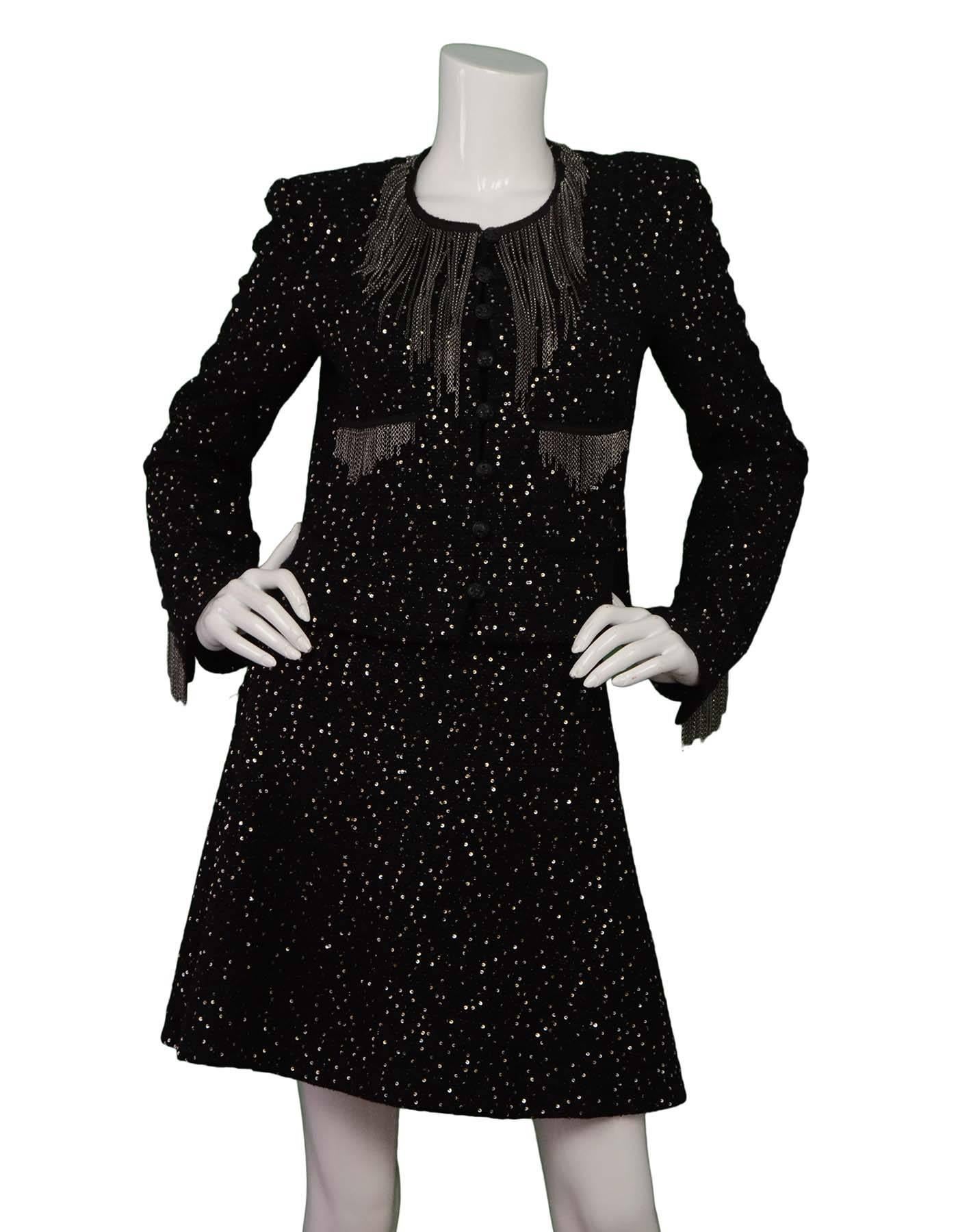 Chanel Black Tweed Sequin & Chain Fringe Skirt Suit
Made In: France
Year of Production: 2002
Color: Black
Composition: 66% wool, 14% cotton, 13% nylon, 5% vinyon, 1% polyester, 1% rayon
Lining: Black, Jacket- 95% silk, 5% spandex, Skirt-