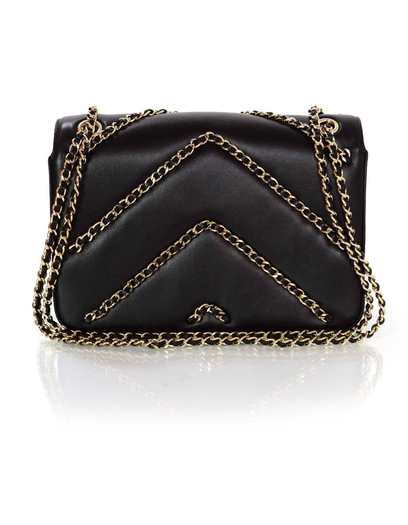 Chanel NEW Black Chevron Chain Flap Bag
Features black leather woven chain links throughout front and back for Chevron effect

Made In: Italy
Year of Production: 2016
Color: Black
Hardware: Pale goldtone
Materials: Leather and metal
Lining: