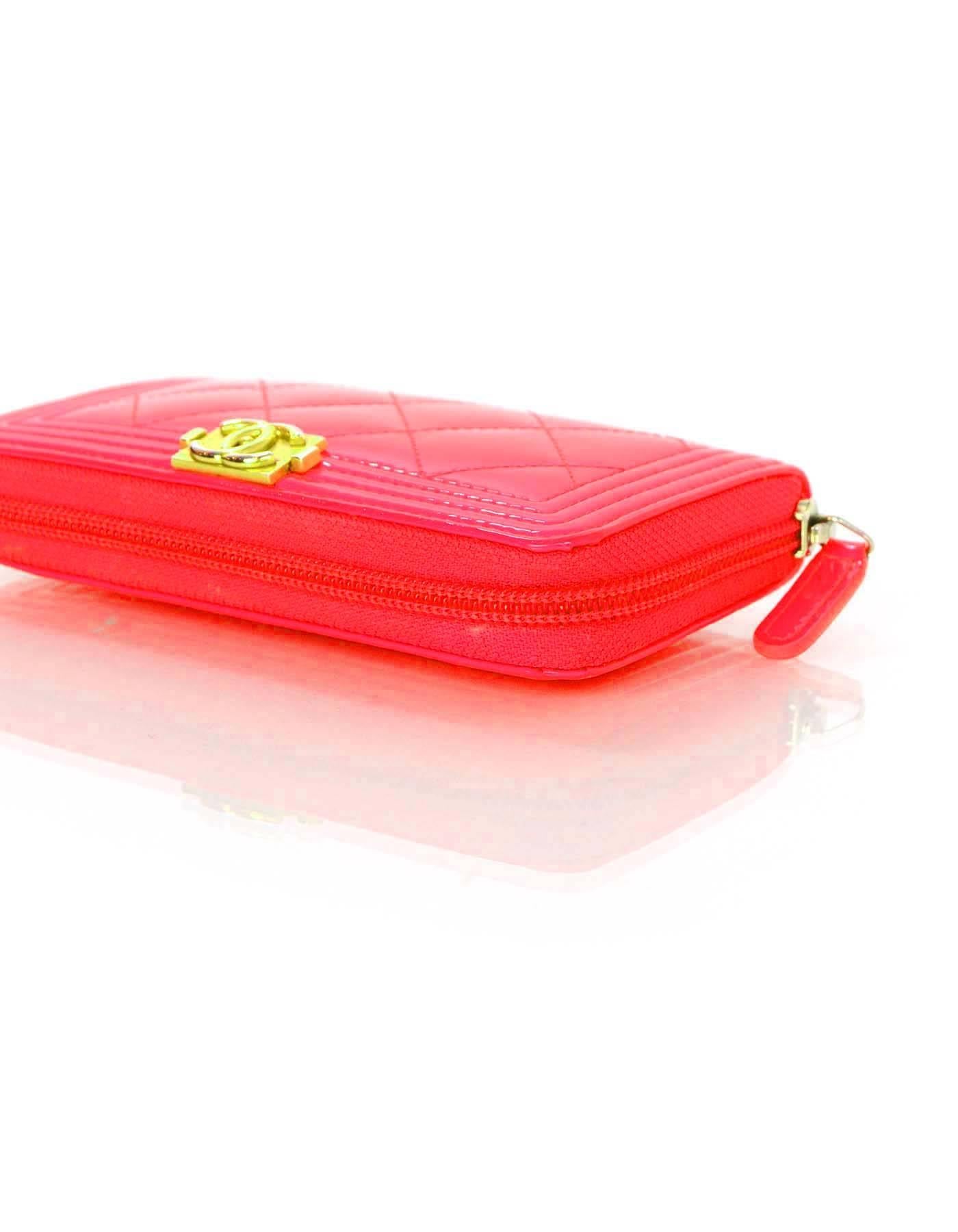 Chanel Neon Pink Patent Leather Small Boy Wallet
Features quilting throughout

Made In: Italy
Year of Production: 2016
Color: hott/neon pink
Hardware: Goldtone
Materials: Patent leather, metal
Lining: Neon pink leather and