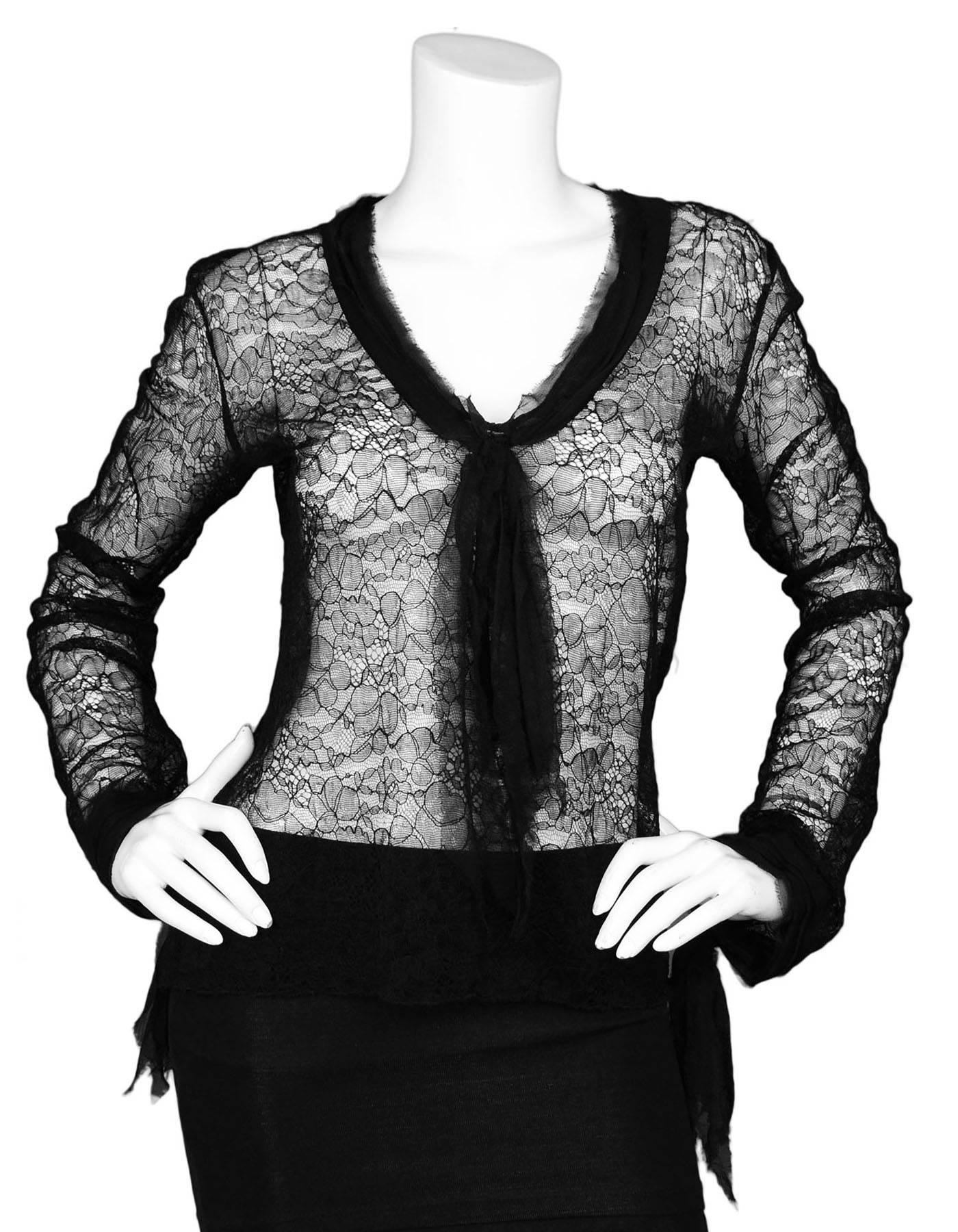 Chanel Black Lace Long Sleeve Blouse 
Features chiffon trim and bow details throughout

Color: Black
Composition: Lace and chiffon
Lining: None
Closure/Opening: Pull over
Exterior Pockets: None
Interior Pockets: None
Overall Condition: