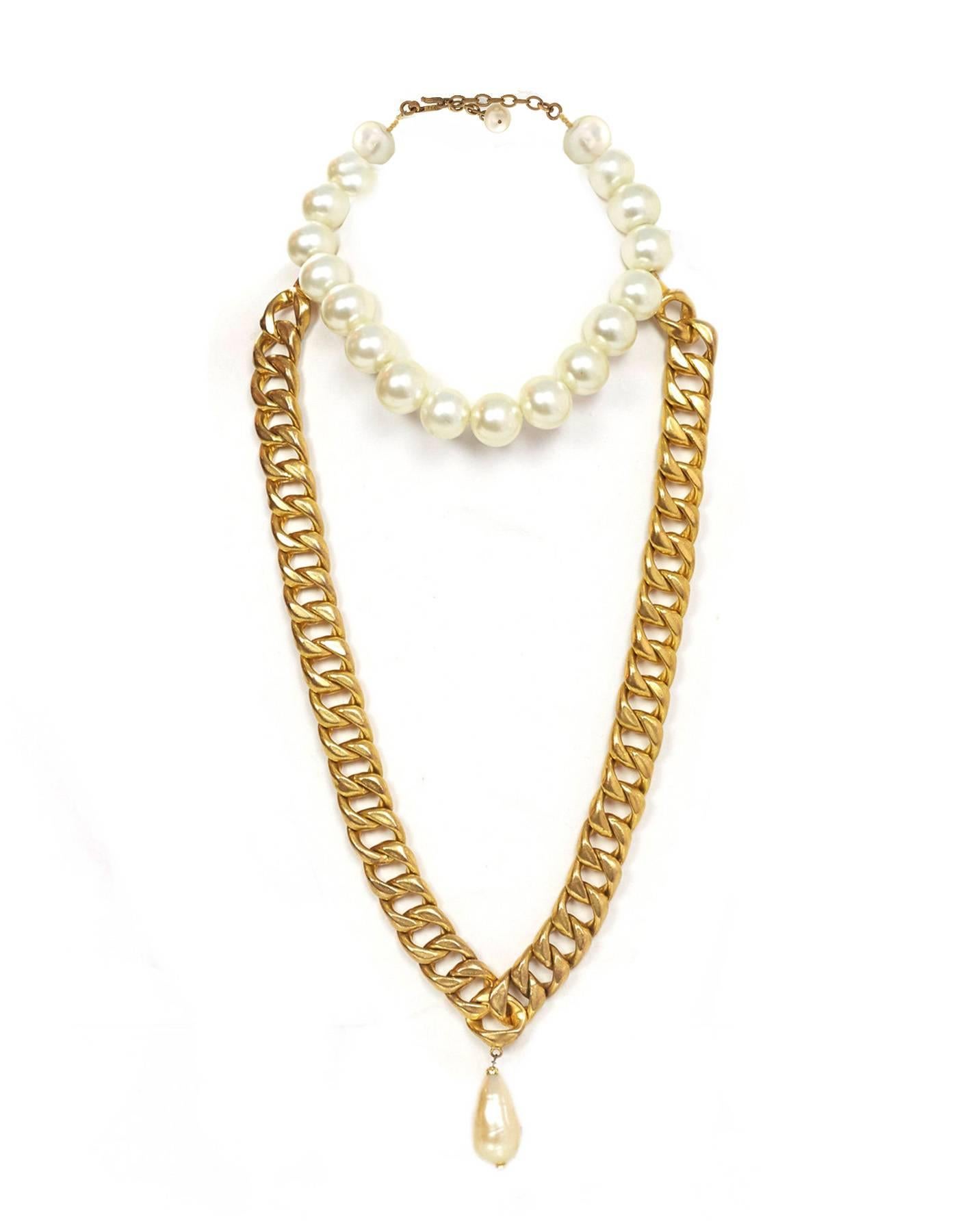 Chanel Chain Link & Gripoix Long Necklace 
Features large pearl tear drop at bottom

Color: Goldtone and ivory
Materials: Metal and faux pearl 
Closure/Opening: Hook closure
Overall Condition: Excellent vintage, pre-owned condition with the