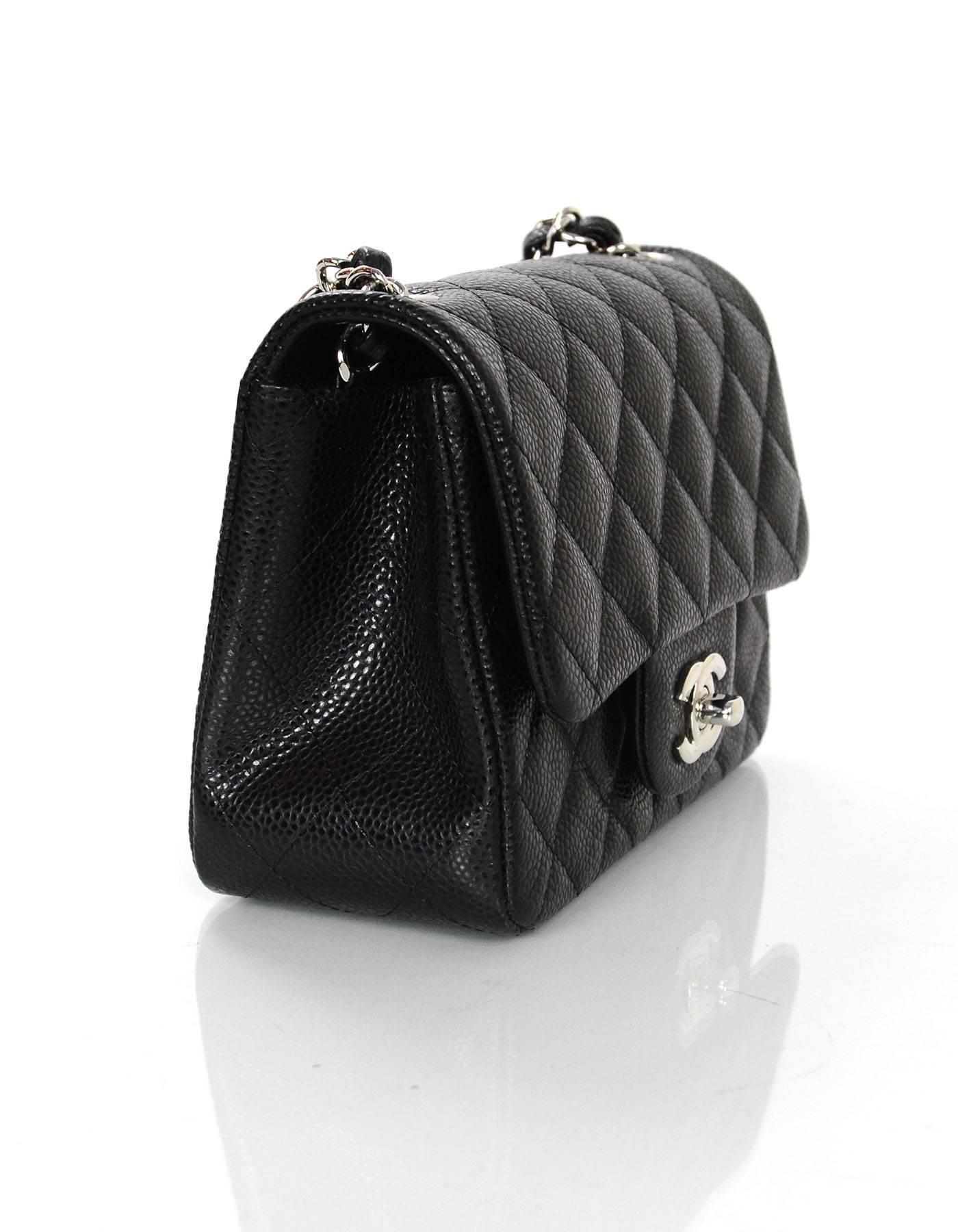 100% Authentic Chanel Black Caviar Mini Flap Bag.  Features classic quilting with CC tiwst-lock closure.

Made in: France
Year of Production: 2015
Color: Black
Hardware: Silvertone
Materials: Leather, metal
Lining: Black