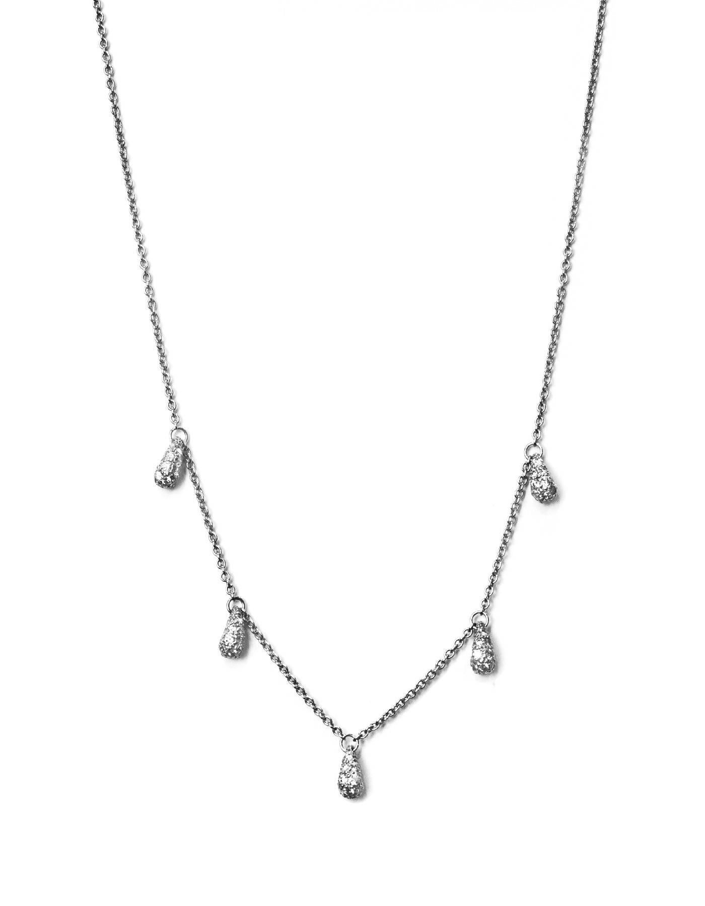 Tiffany & Co. Elsa Peretti Diamond & Platinum Necklace
Features 5 tear drop pendants with pavé diamonds set in platinum. Tear drops inspired by a solitary raindrop or a shining bead of morning dew.
Color: Silver
Materials: Diamonds and