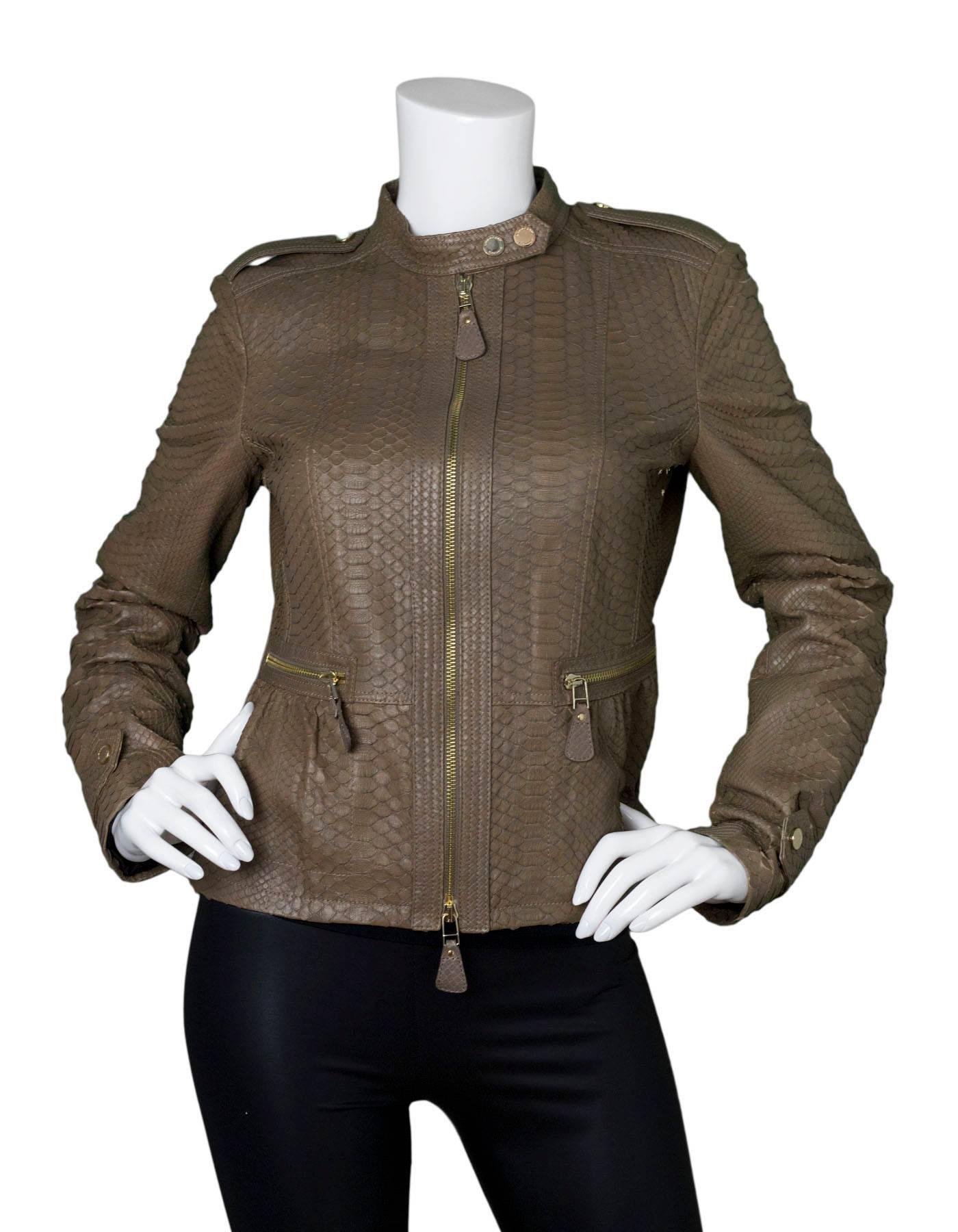 Burberry London Fawn Python Peplum Jacket 

Made In: Italy
Color: Fawn
Composition: 100% python skin
Closure/Opening: Front double zip closure
Exterior Pockets: Two hip zip pockets
Interior Pockets: None
Retail Price: $5,750 + tax
Overall Condition: