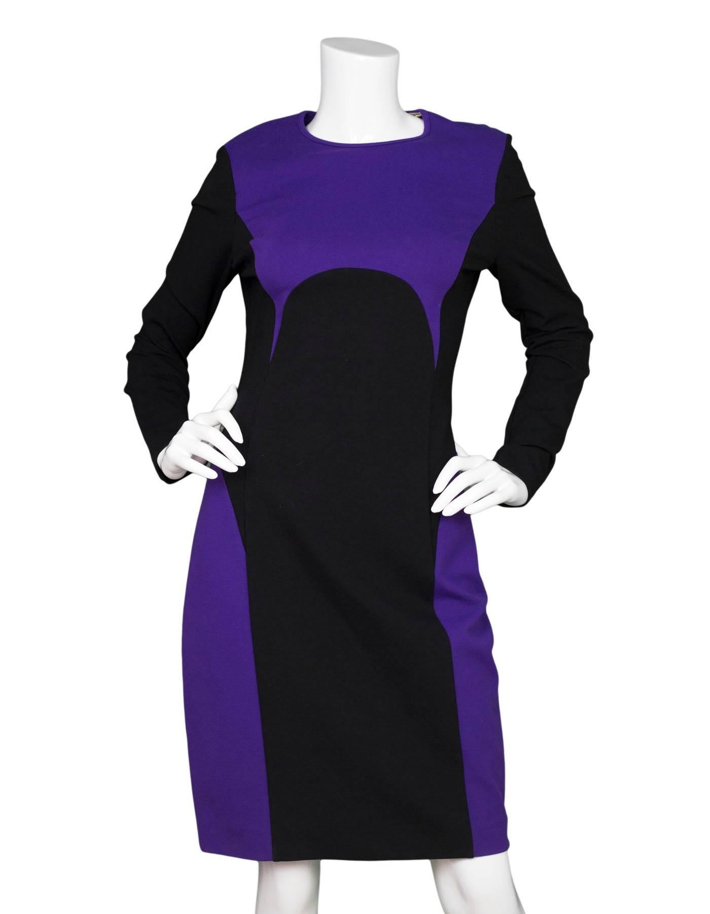 Michael Kors Purple & Black Sheath Dress

Made In: Italy
Color: Black and purple
Composition: 73% rayon, 22% polyamide, 5% spandex
Lining: Purple and black, 61% acetate, 39% rayon
Closure/Opening: Back zip up
Exterior Pockets: None
Interior