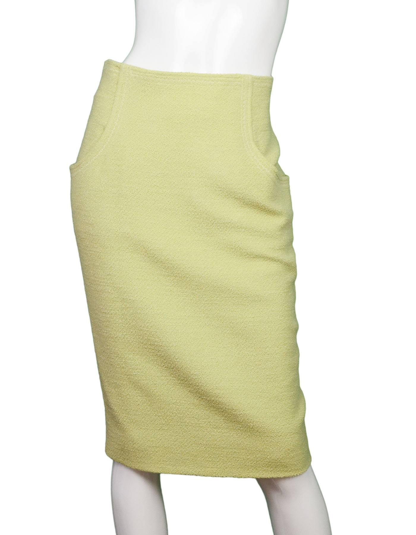 Chanel Chartreuse Boucle Skirt

Color: Chartreuse green
Composition: Not given- believed to be a wool blend
Lining: Chartreuse silk-blend
Closure/Opening: Back zip up closure
Exterior Pockets: Two hip pockets
Interior Pockets: None
Overall