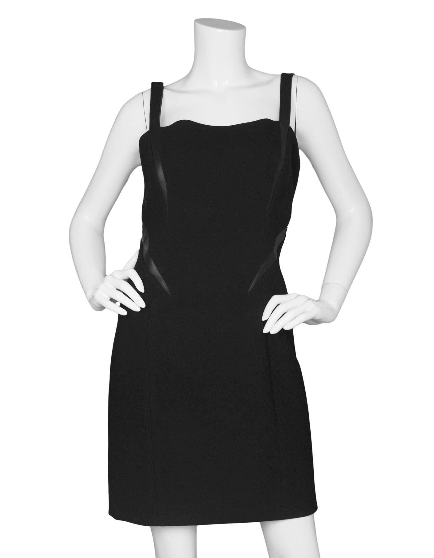 Michael Kors Black Shift Dress
Features leather trim and shoulder straps

Made In: Italy
Color: Black 
Composition: Not given- believed to be a wool-blend, trim- 100% leather
Lining: Black, nylon-blend
Closure/Opening: Back center zip up
Exterior