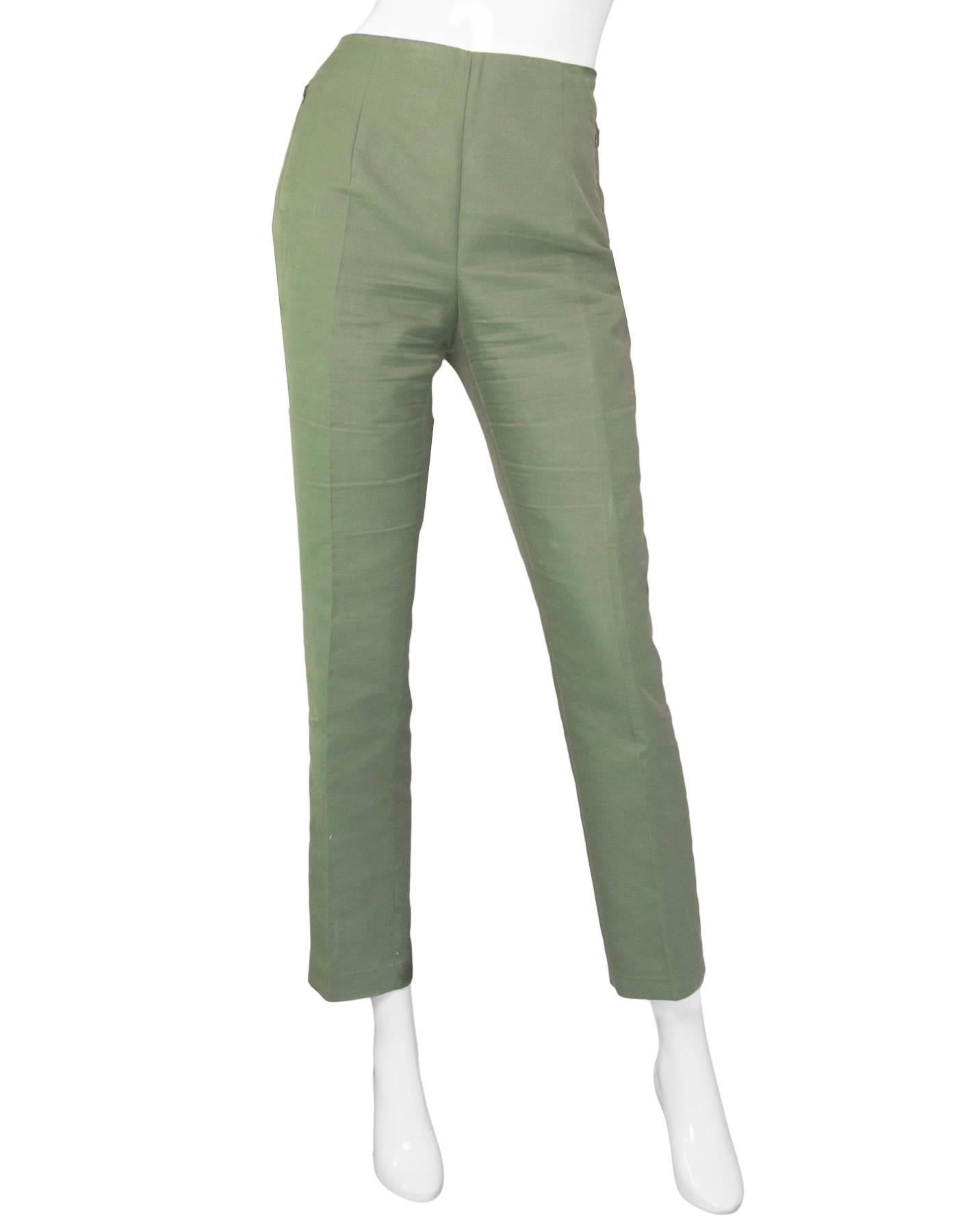 Akris Green Cropped Pants Sz 10

Made In: Romania
Color: Green
Composition: 59% cotton, 39% silk, 2% nylon
Lining: None
Closure/Opening: Hidden side zip and button closure
Exterior Pockets: Zip pockets at hips
Overall Condition: Excellent pre-owned