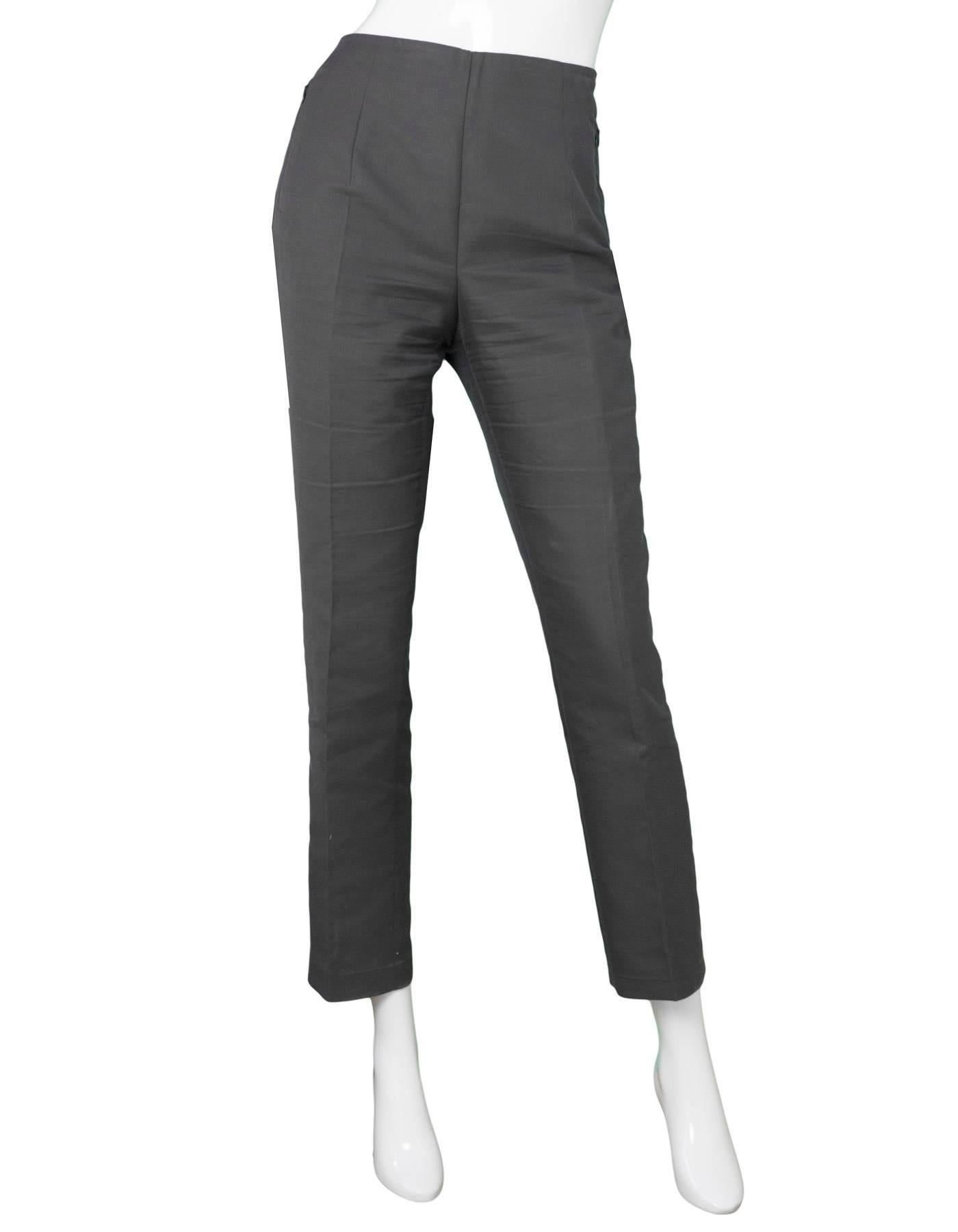Akris Grey Cropped Pants Sz 8

Made In: Romania
Color: Grey
Composition: 59% cotton, 39% silk, 2% nylon
Lining: None
Closure/Opening: Hidden side zip and button closure
Exterior Pockets: Zip pockets at hips
Overall Condition: Excellent pre-owned