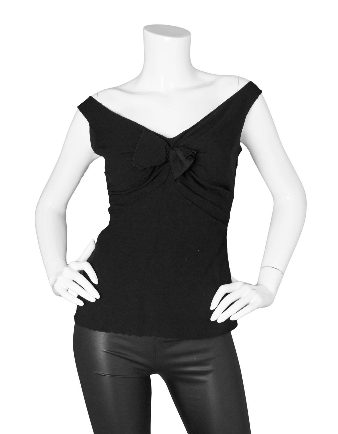 Prada Black Sleeveless Ruched Blouse 
Features bow at ruched neckline

Made In: Italy
Color: Black
Composition: 78% acetate, 22% polyethylene
Lining: None
Closure/Opening: Side zipper
Exterior Pockets: None
Interior Pockets: None
Overall Condition: