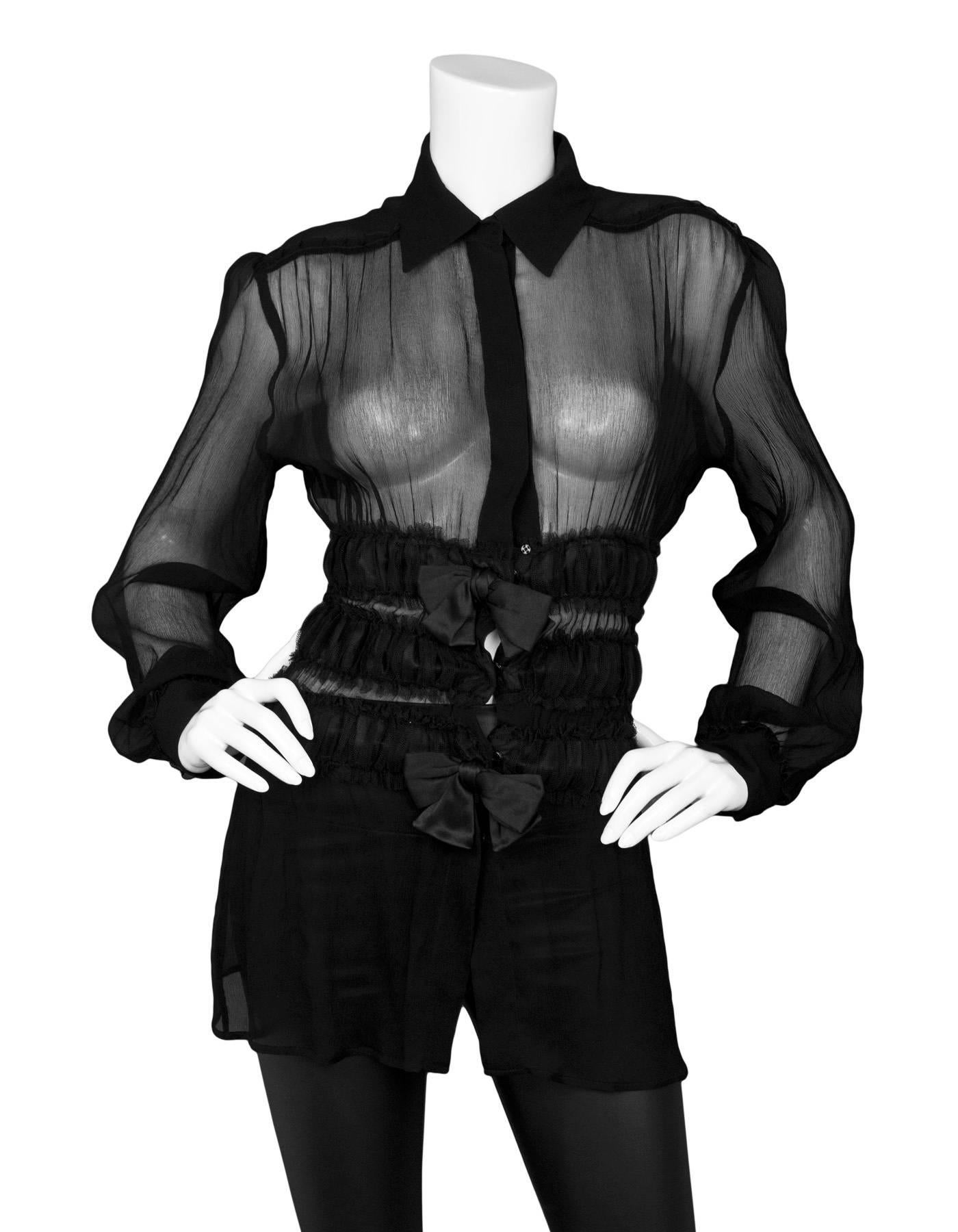 Jean Paul Gaultier Black Silk Long Sleeve Ruffle Top 
Features cinching at waist

Made In: Italy
Color: Black
Composition: 100% silk
Lining: None
Closure/Opening: Snap button front
Exterior Pockets: None
Interior Pockets: None
Overall Condition: