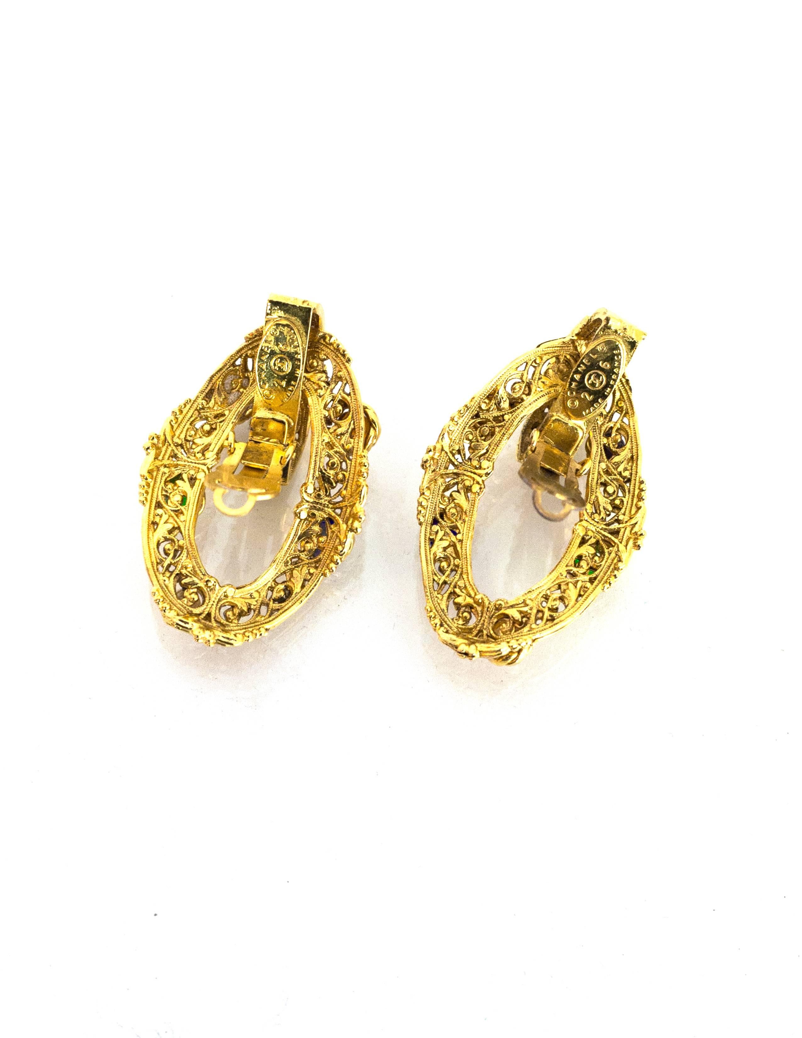 Chanel Goldtone & Gripoix Filigree Clip-On Earrings

Made In: France
Year of Production: 1987
Color: Gold
Materials: Metal, gripoix
Closure: Clip on
Stamp: Chanel 2 CC 6 Made In France
Overall Condition: Excellent pre-owned vintage condition