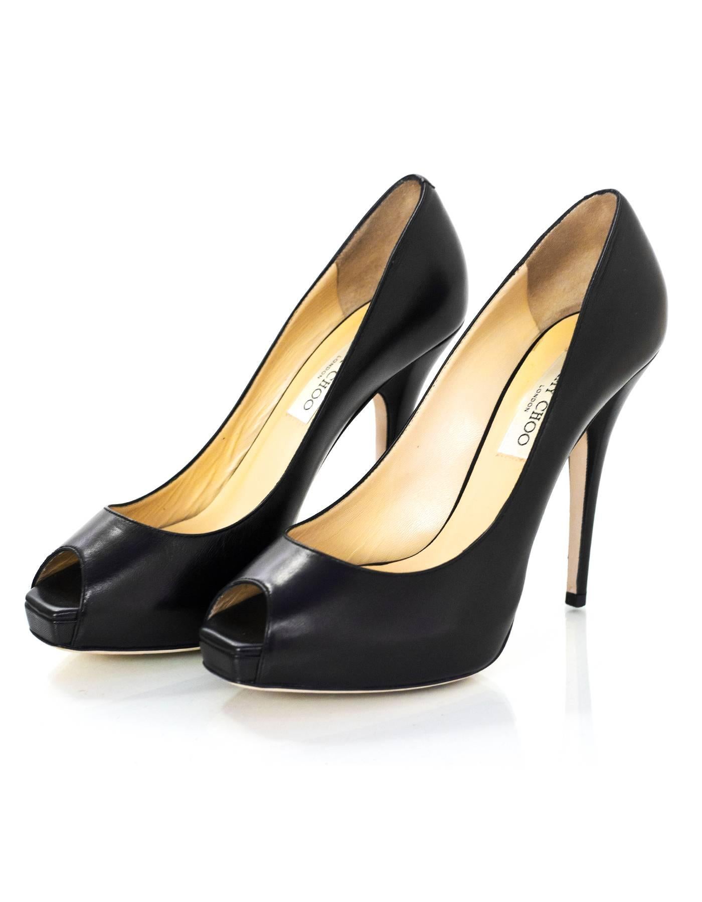 Jimmy Choo Black Leather Peep-Toe Comet Pumps Sz 39

Made In: Italy
Color: Black
Materials: Leather
Closure/Opening: Slide on
Sole Stamp: Jimmy Choo London Made in Italy 39
Retail Price: $695 + tax
Overall Condition: Excellent pre-owned condition