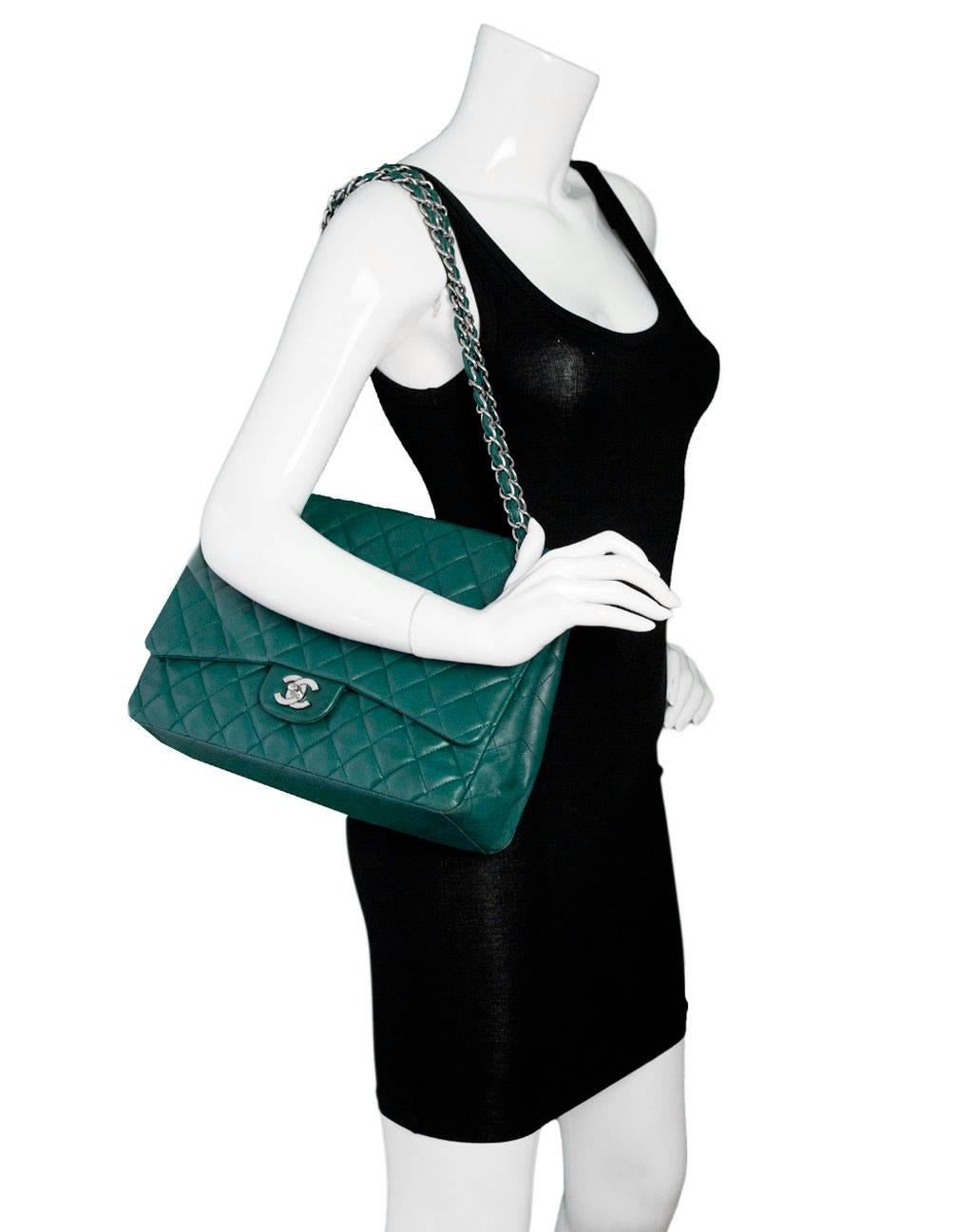 Chanel Teal Quilted Lambskin Single Flap Classic Maxi Bag
Features adjustable shoulder strap

Made In: France
Year of Production: 2009 -2010
Color: Teal
Hardware: Silvertone
Materials: Lambskin leather
Lining: Teal leather
Closure/Opening: Flap top