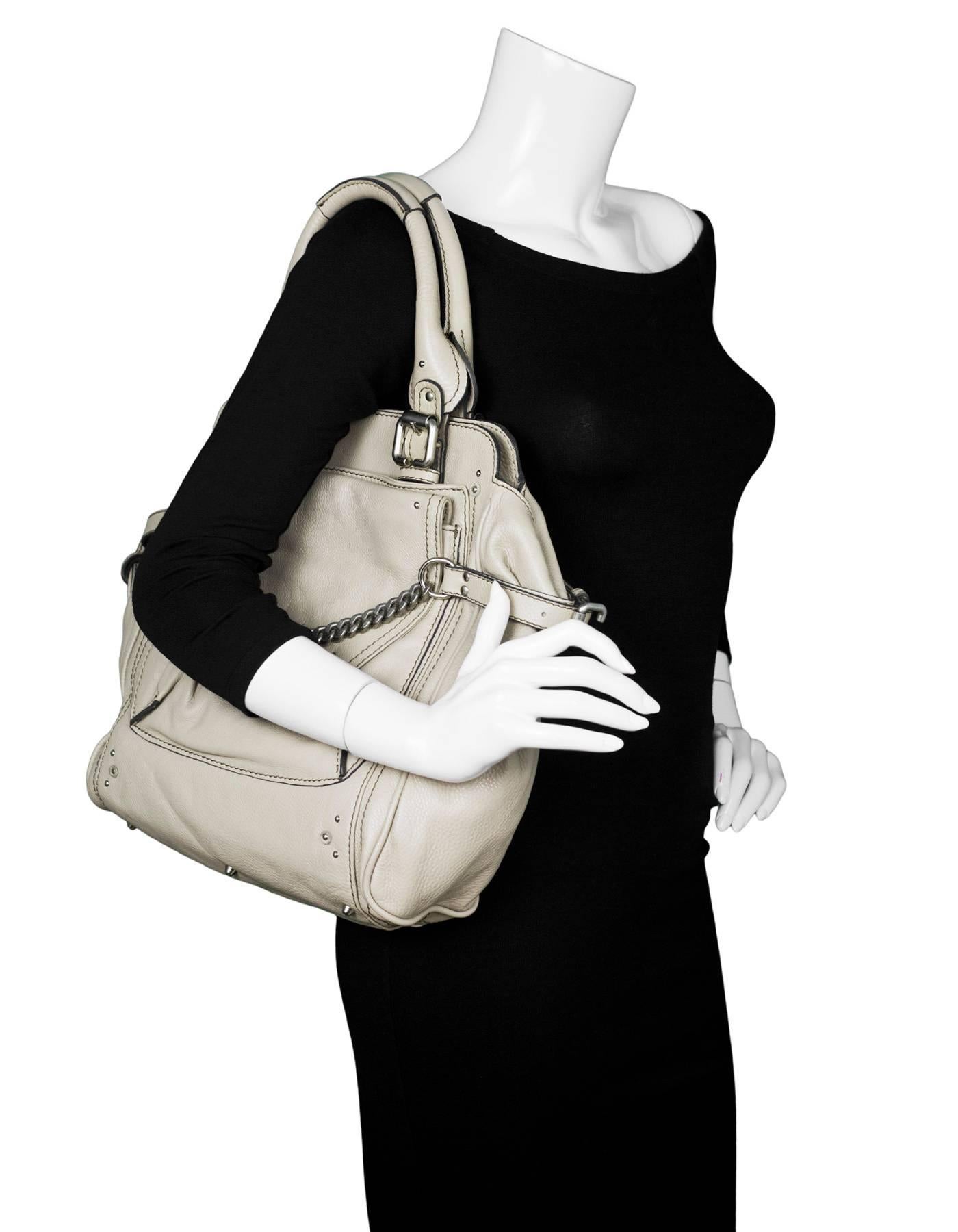 Chloe Beige Leather Large Paddington Capsule Tote

Made In: Italy
Color: Beige
Hardware: Silvertone
Materials: Leather, metal
Lining: Cream textile
Closure/Opening: Open top with magnetic closure
Exterior Pockets: Pocket at back, pocket and flap