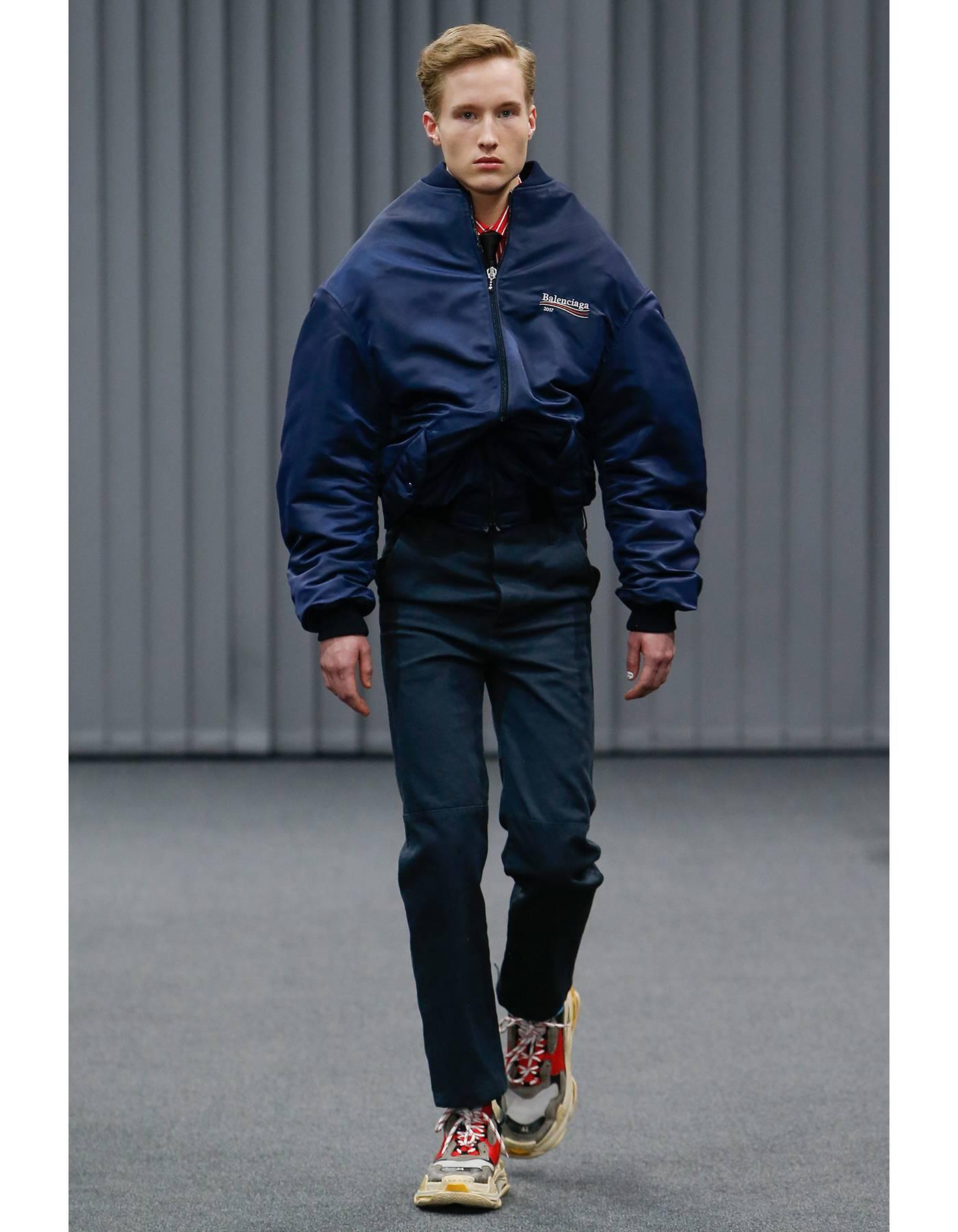 Balenciaga 2017 Men's Wobble Embroidered Bomber Jacket

Made In: Tunisia
Color: Navy
Composition: 100% polyester
Lining: Navy, 100% cupro
Closure/Opening: Zip down front closure
Exterior Pockets: Two hip pockets
Interior Pockets: None
Retail Price: