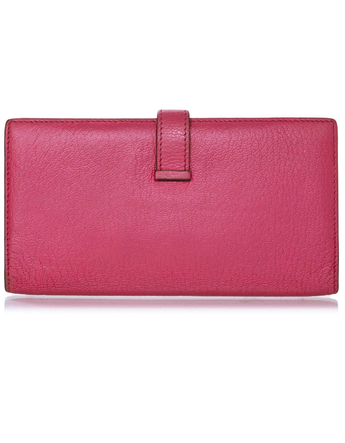 Hermes Rose Tyrien Chevre Mysore Leather Bearn Wallet

Made In: France
Year of Production: 2010
Color: Rose Tyrien
Hardware: Palladium
Materials: Chevre leather
Lining: Rose leather
Closure/Opening: Bi-fold with H tab closure
Exterior Pockets: