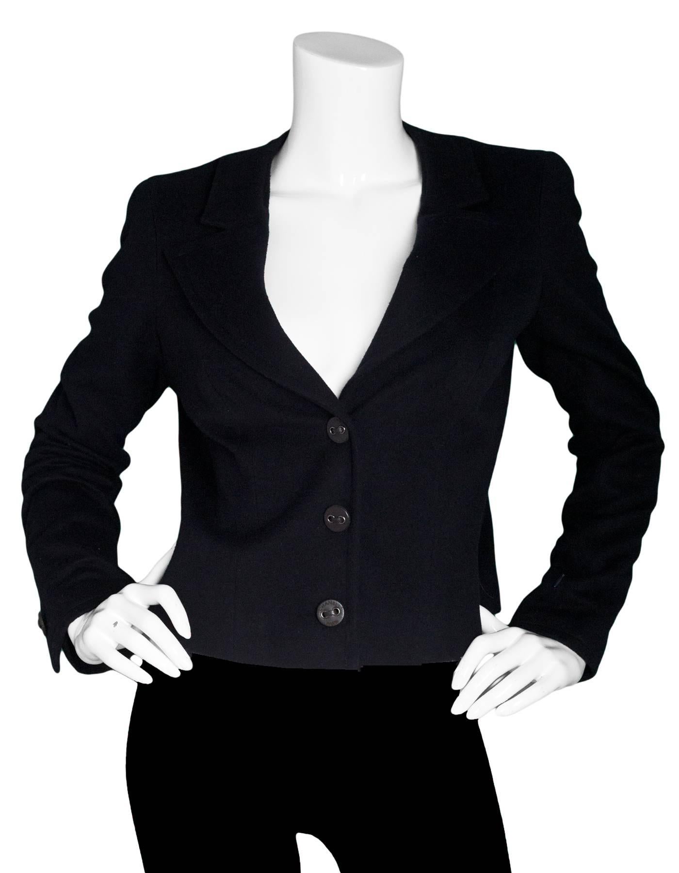Chanel Black Cashmere Jacket Sz FR 42

Made In: France
Color: Black
Composition: 100% Cashmere
Lining: Black textile
Closure/Opening: Front snap button closure
Exterior Pockets: None
Interior Pockets: None
Overall Condition: Excellent pre-owned