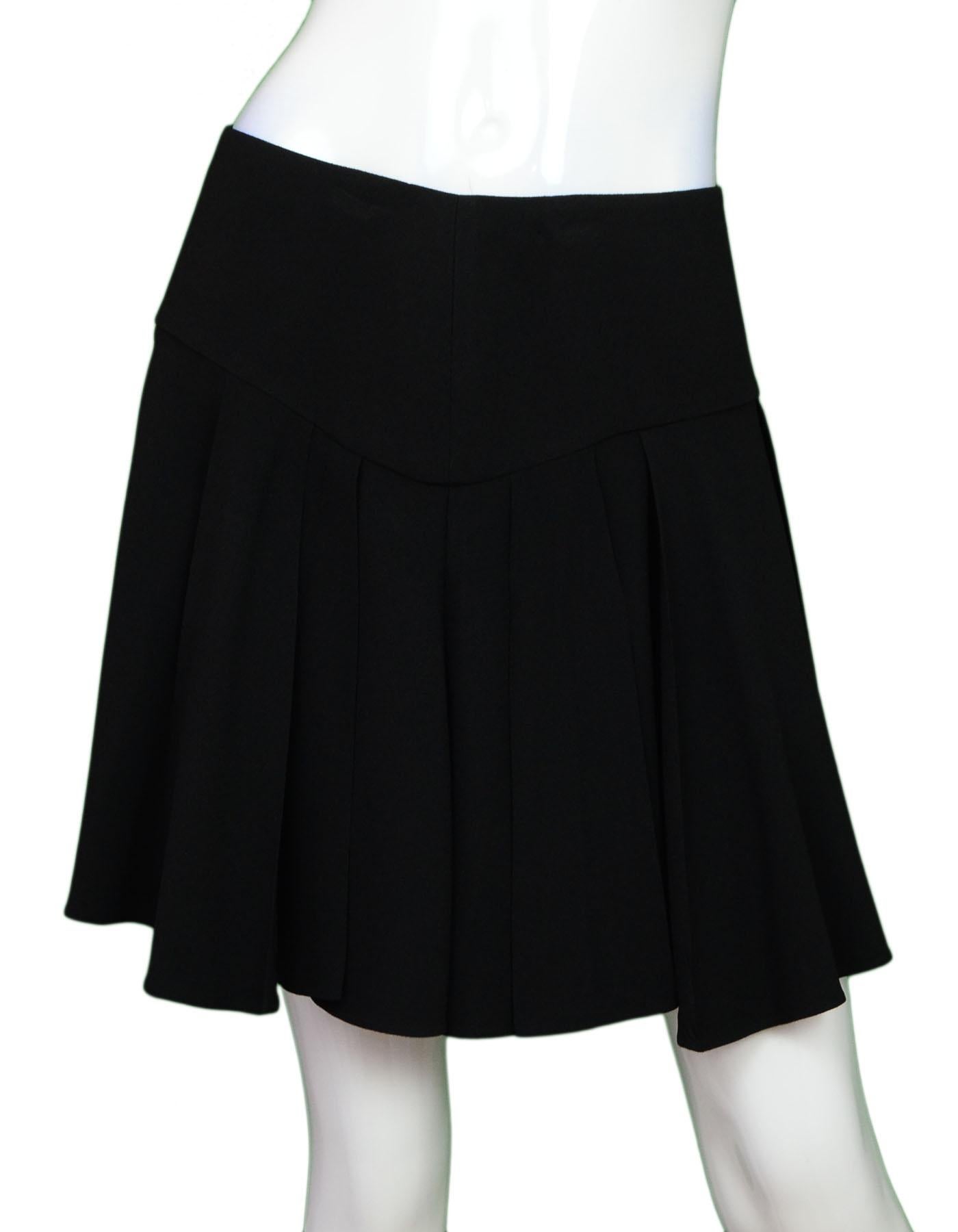 Saint Laurent Black Pleated Mini Skirt

Made In: Italy
Color: Black
Composition: 57% acetate, 43% viscose
Lining: None
Closure/Opening: Side zip closure
Overall Condition: Excellen pre-owned condition

Marked Size: Not listed - please refer to