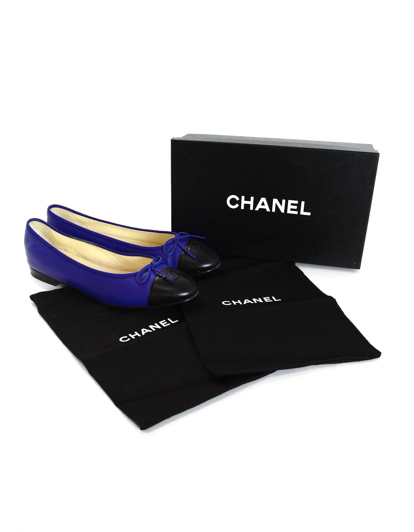 Chanel Royal Blue/Black Leather Cap Toe CC Ballet Flats Sz 42

Made In: Italy
Year of Production: 2013
Color: Royal blue and black
Materials: Leather
Closure/Opening: Slide on
Overall Condition: Excellent pre-owned condition
Estimated Retail: $750 +