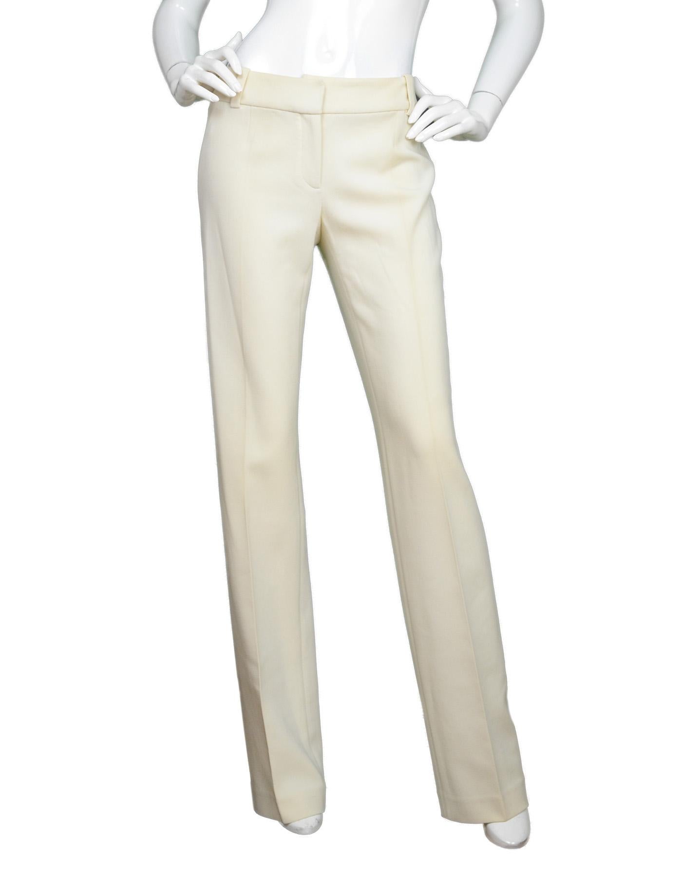 Celine Cream Straight Leg Slacks Pants Sz 36

Made In: France
Color:  Cream
Materials: 96% wool, 4% elastane
Overall Condition: Excellent pre-owned condition with exception of spot on back belt loop

Measurements:   
Waist: 29