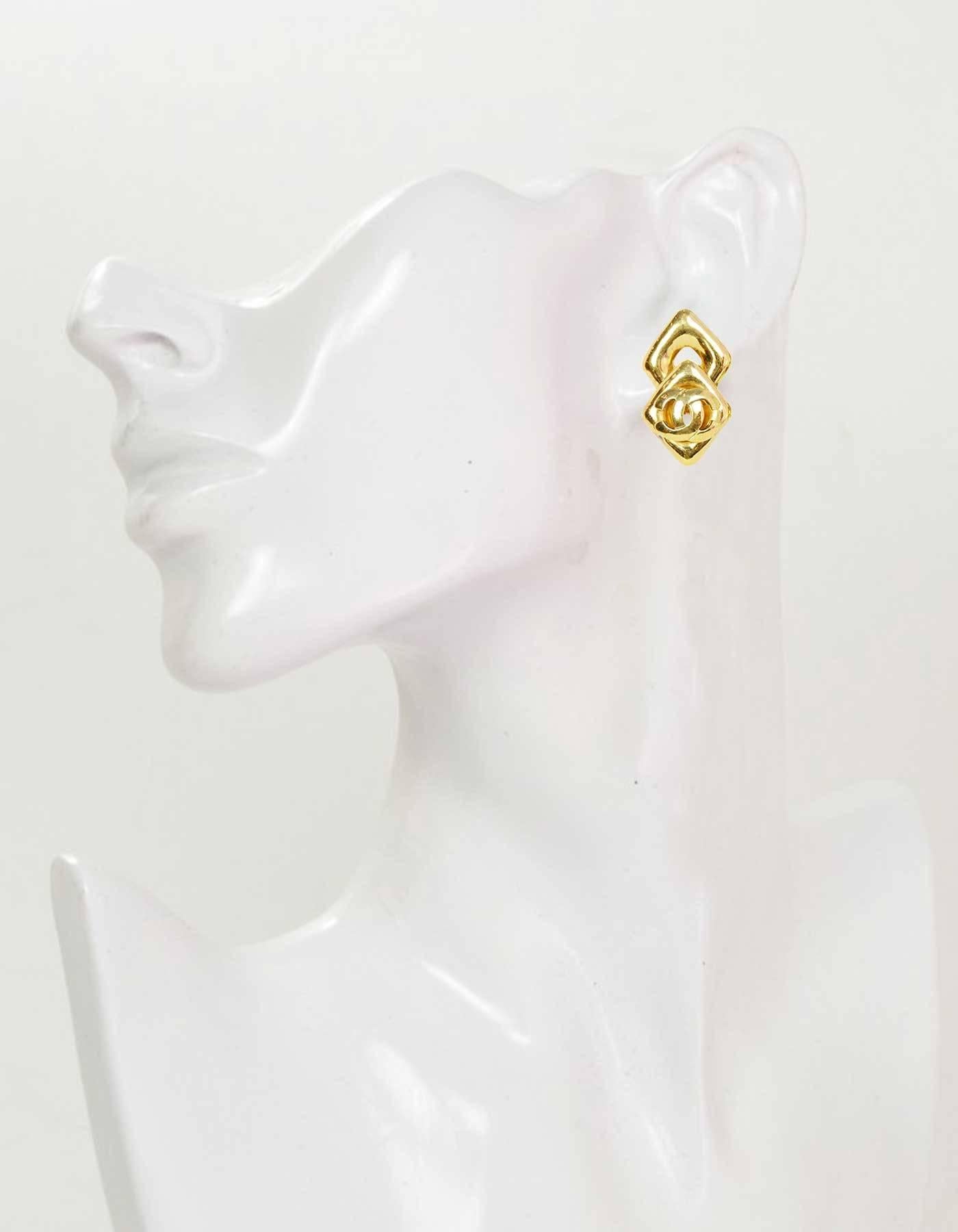 Chanel Vintage '97 Gold Two-Tier Double Diamond CC Clip On Earrings
Features CC's on lower diamonds

Made in: France
Year of Production: 1997
Stamp: 97 CC P
Closure: Clip on
Color: Gold
Materials: Metal
Overall Condition: