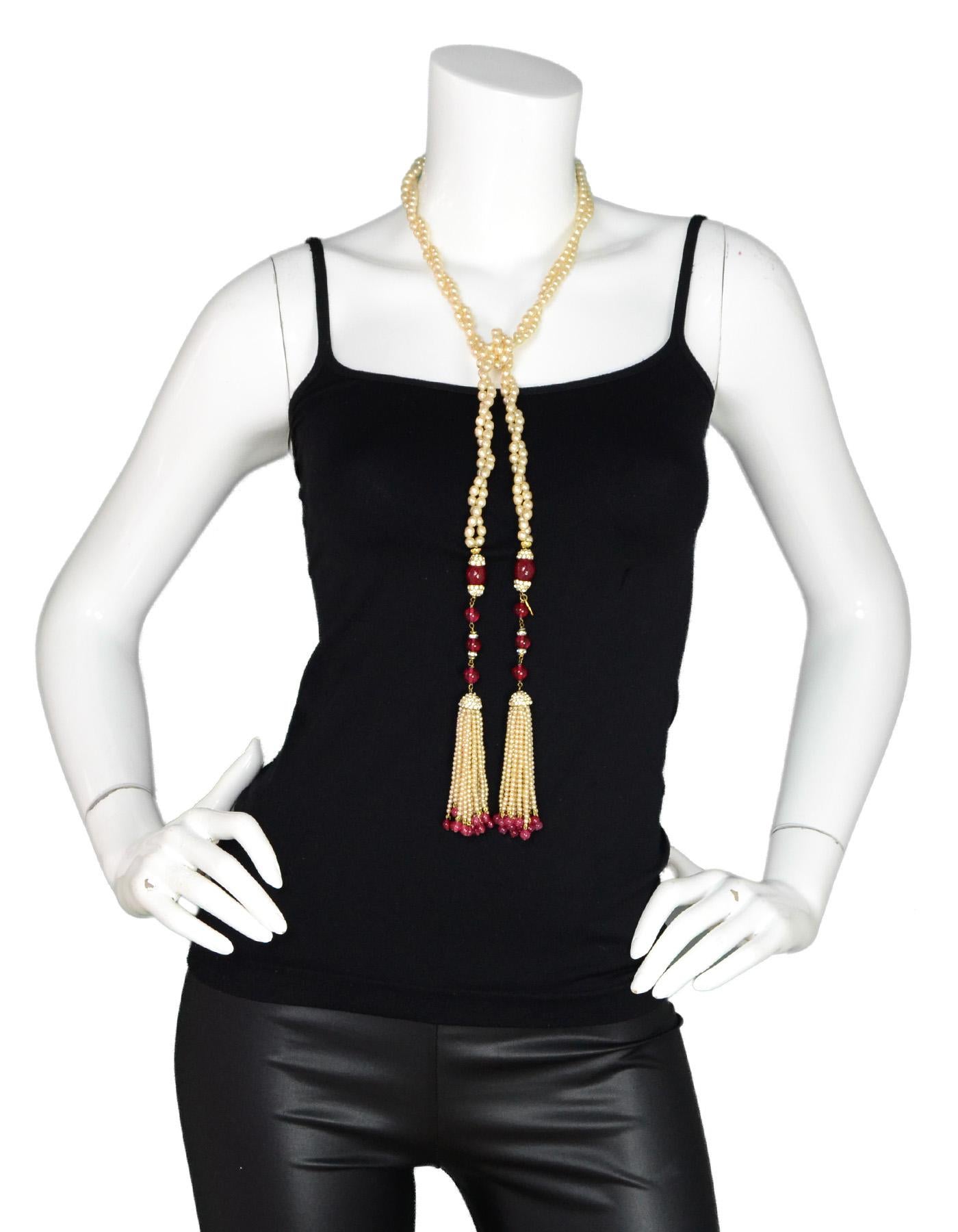 Chanel 1983 Vintage Double Strand Faux Pearl/Strass Crystal Lariant Necklace W/ Tassels

Made in: France
Year of Production: 1983
Color: Red, white, goldtone
Materials: Goldtone metal, crystals, faux stones and faux pearls
Closure: Wrap/drape