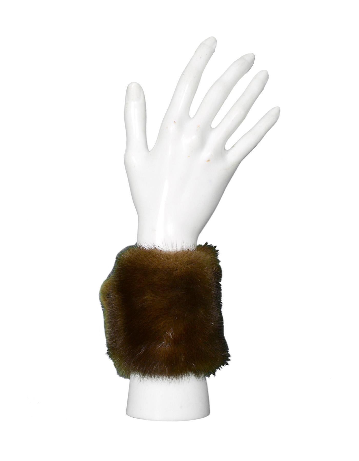 Yves Saint Laurent YSL Brown Mink Cuffs 

Color: Brown
Materials: Mink
Lining: Black leather
Closure/Opening: Open 
Overall Condition: Excellent pre-owned condition with the exception of no tags or label

Measurements:
Total Length: 9.5