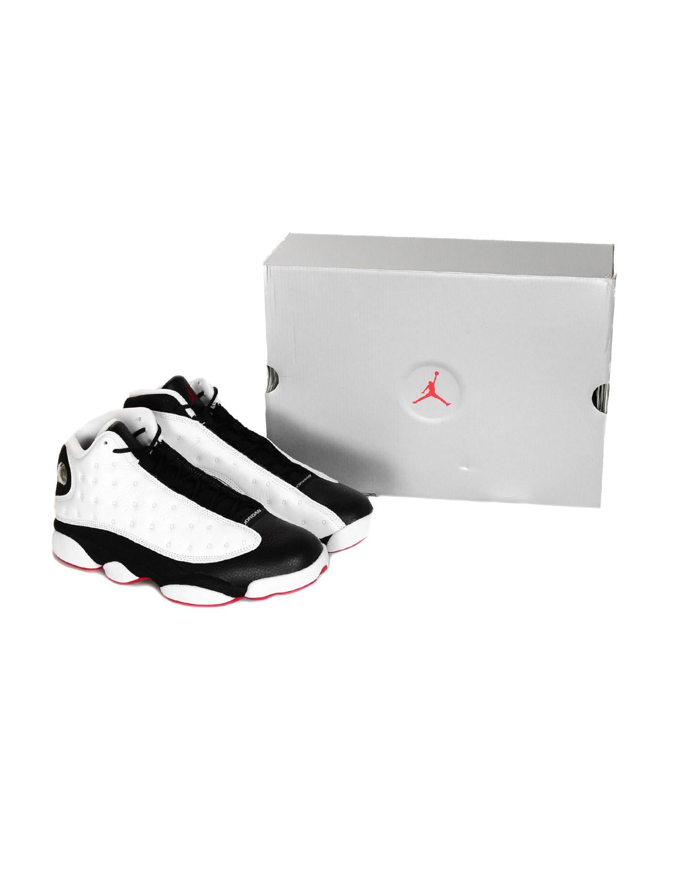 Nike Men's White/Black NEW Air Jordan 13 Retro Sneakers Sz 9.5 W/ Box

Made In: China
Color: White/black
Materials: Leather and rubber
Closure/Opening:  Lace up front
Overall Condition: Like new condition in original box
Includes: Air Jordan