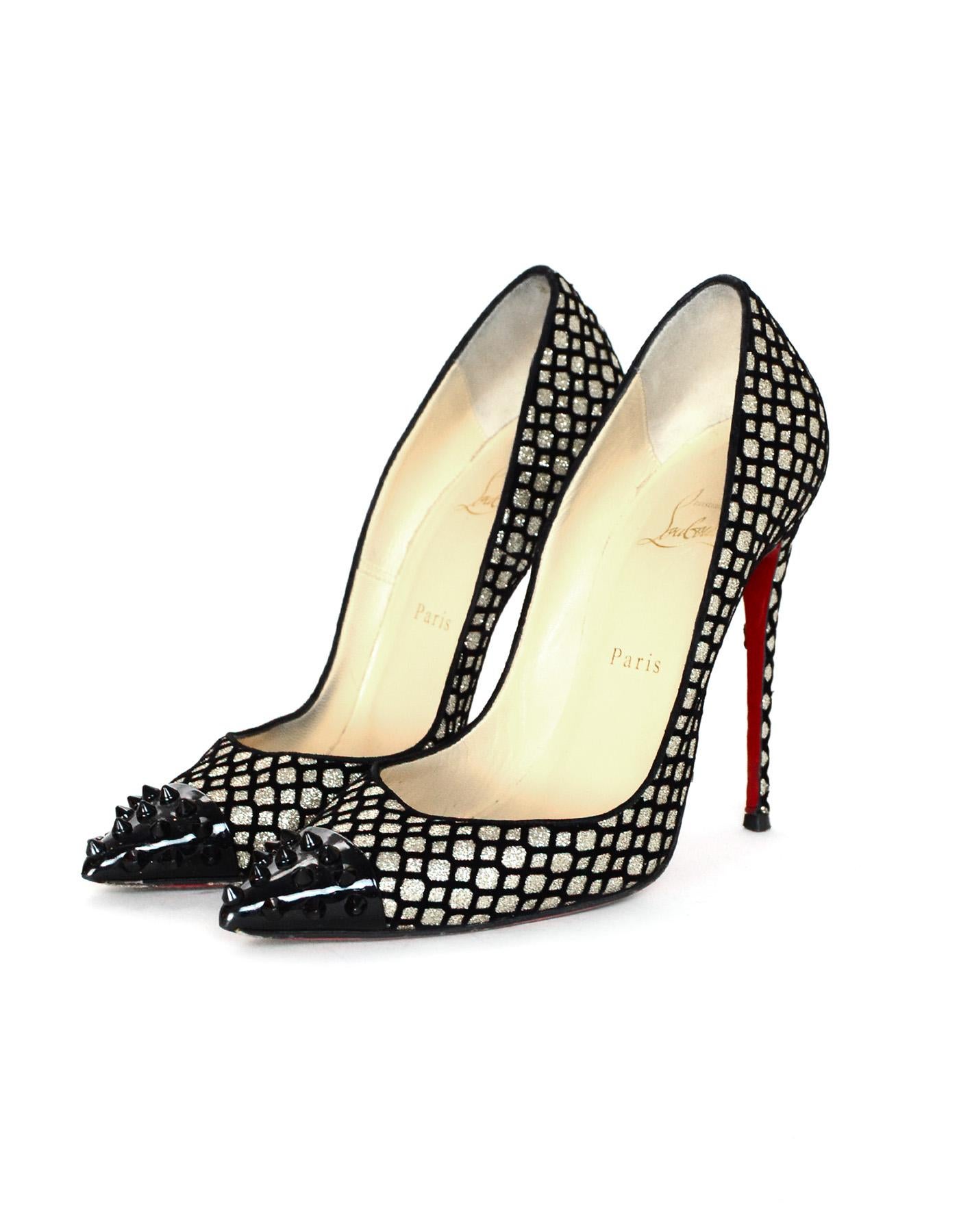Christian Louboutin Black Velvet/Silver Fishnet Mermaid Design W/ Spike Cap Toe Sz 39

Made In: Italy
Color: Black and silver
Materials: Glitter, leather, metal, and velvet
Closure/Opening: Slide on
Overall Condition: Good pre-owned condition with
