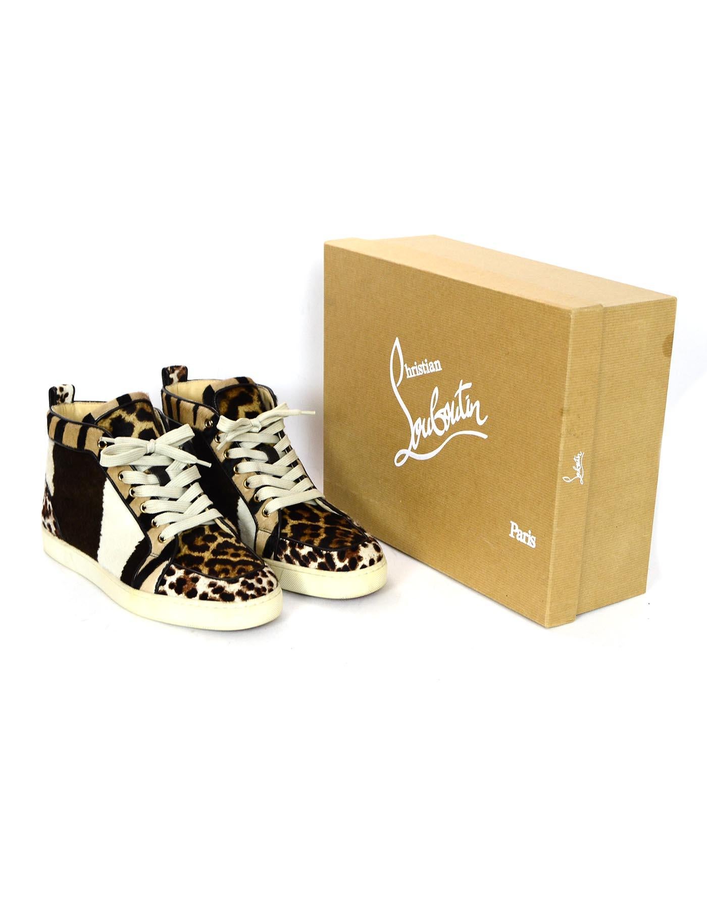Christian Louboutin Leopard Calfskin High Top Sneakers Sz 40

Made In: Italy
Color: Brown, tan, white
Materials: Calfskin 
Closure/Opening: Lace up front
Overall Condition: Excellent pre-owned condition 
Includes: Christian Louboutin