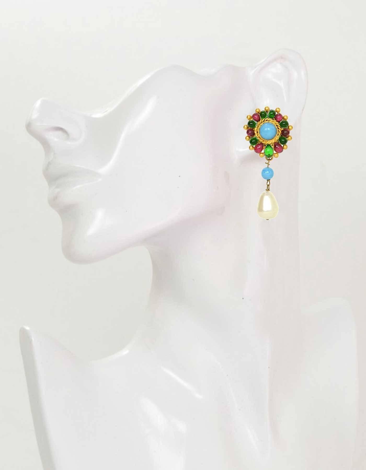 Chanel Vintage '93 Multi Colored & Pearl Teardrop Clip On Earrings

Made in: France
Year of Production: 1993
Stamp: 93 CC A
Closure: Clip on
Color: Gold, turquoise, red, green and ivory
Materials: Metal, poured glass and faux pearl
Overall