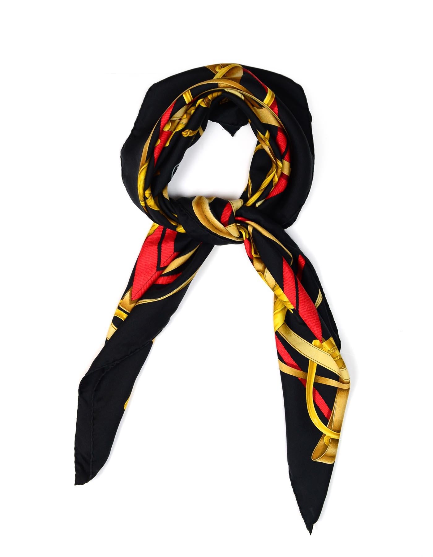 Hermes Red/Black/Gold Grand Manege 90cm Silk Scarf
Print by H dOrigny

Made In: France
Color: Red/black/gold
Materials: 100% silk (no composition tag)
Overall Condition: Excellent pre-owned condition with exception of water mark
Estimated Retail: