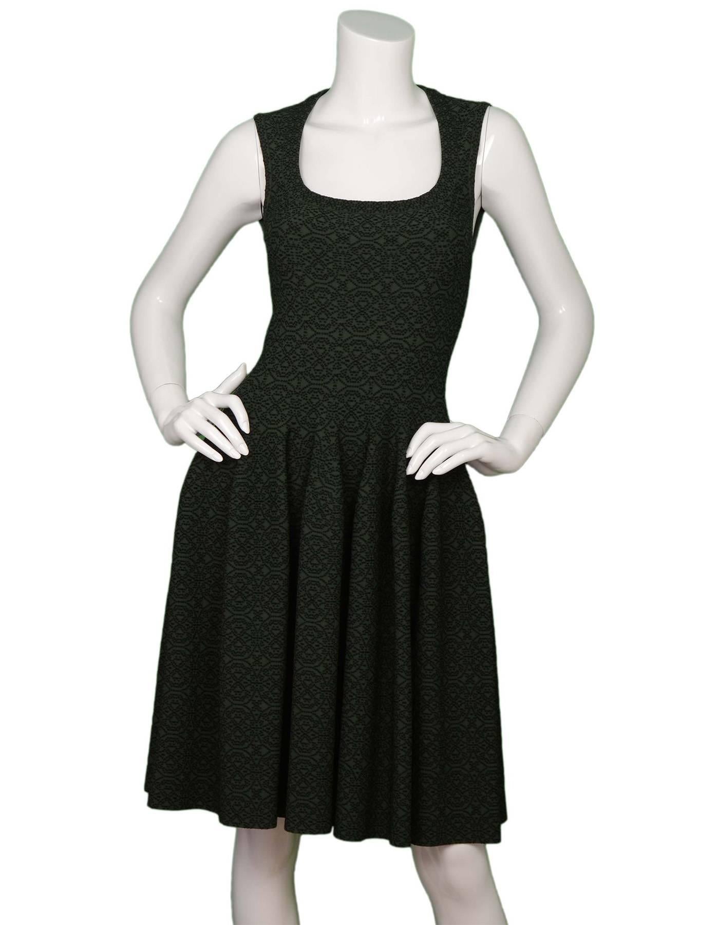 Alaia Dark Green Sleeveless Fit Flare Dress
Features black dotted pattern throughout

Made in: Italy
Color: Dark green and black
Composition: 68% viscose, 21% nylon, 7% polyester, 4% elastane 
Lining: None
Closure/opening: Back center zip