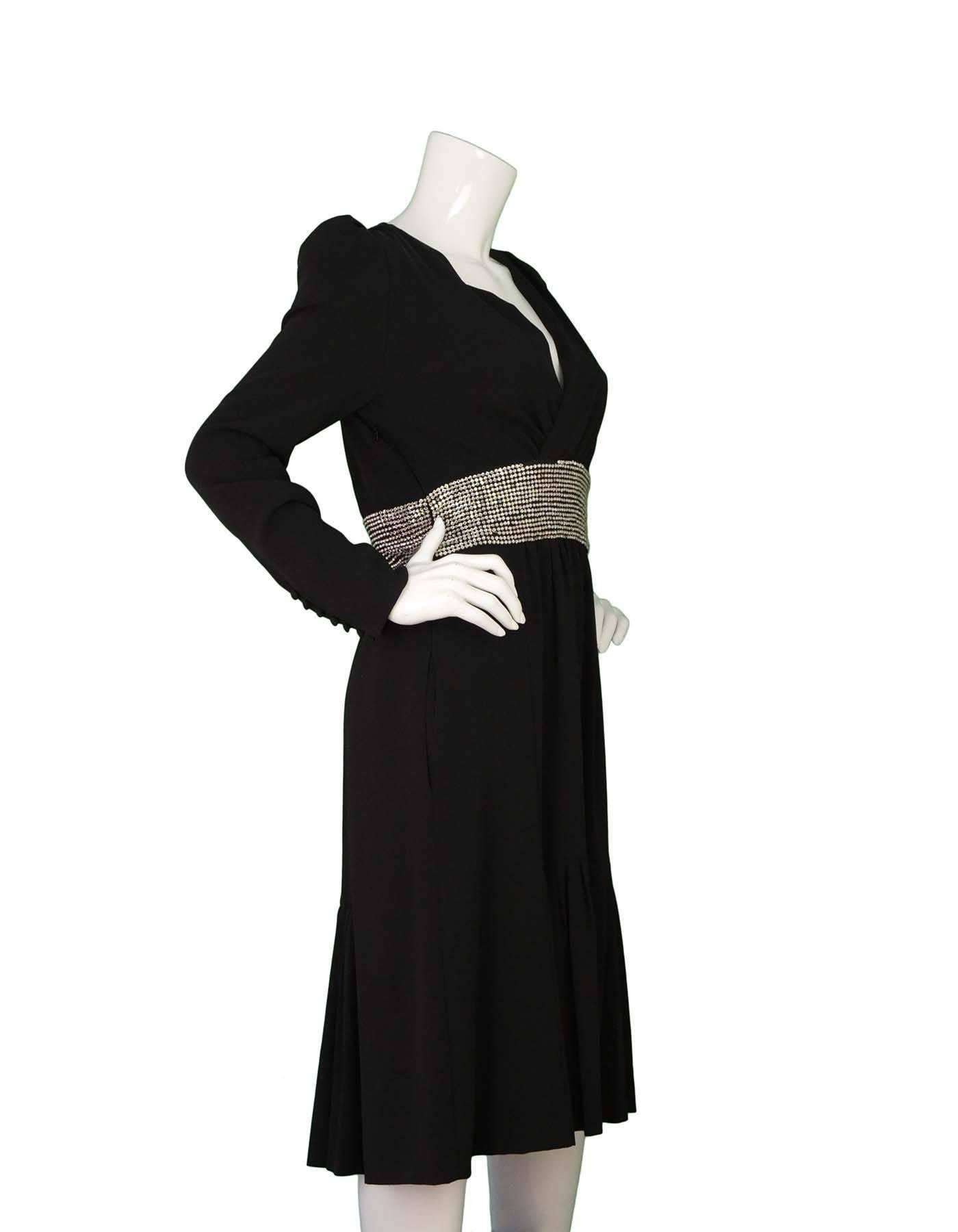 Chloe Black & Rhinestone Long Sleeve Cocktail Dress
Features crystal embellishments at waistline and open back
Made in: France
Color: Black
Composition: 100% silk
Lining: Black, 100% silk
Closure/opening: Side zipper
Exterior Pockets: Two