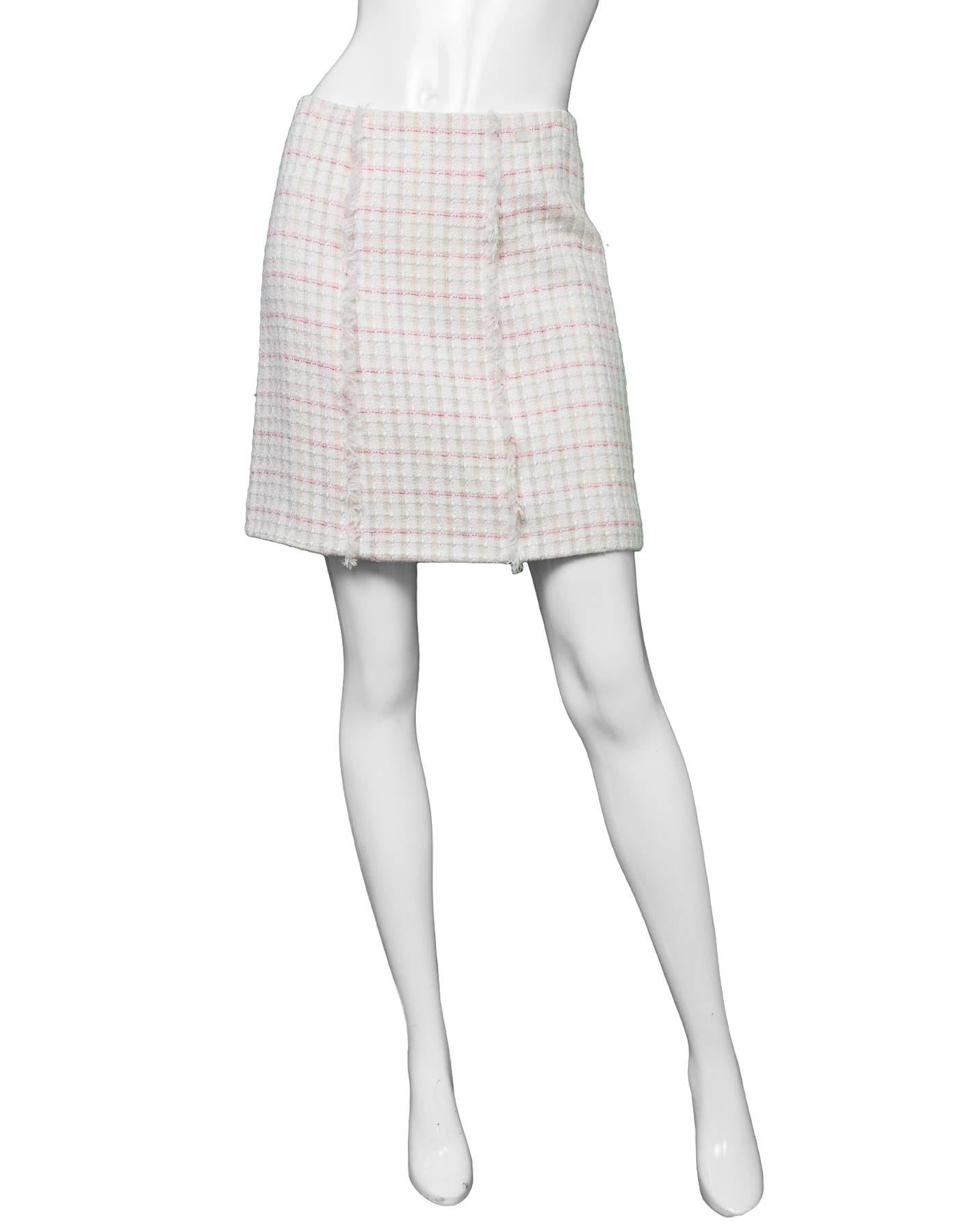 Chanel White Tweed A-Line Skirt 
Features red, green and pink threading throughout as well as vertical fringe on front center panel
Made in: France
Year of Production: 2004
Color: White, red, green, and pink
Composition: 36% wool, 34% nylon, 16%