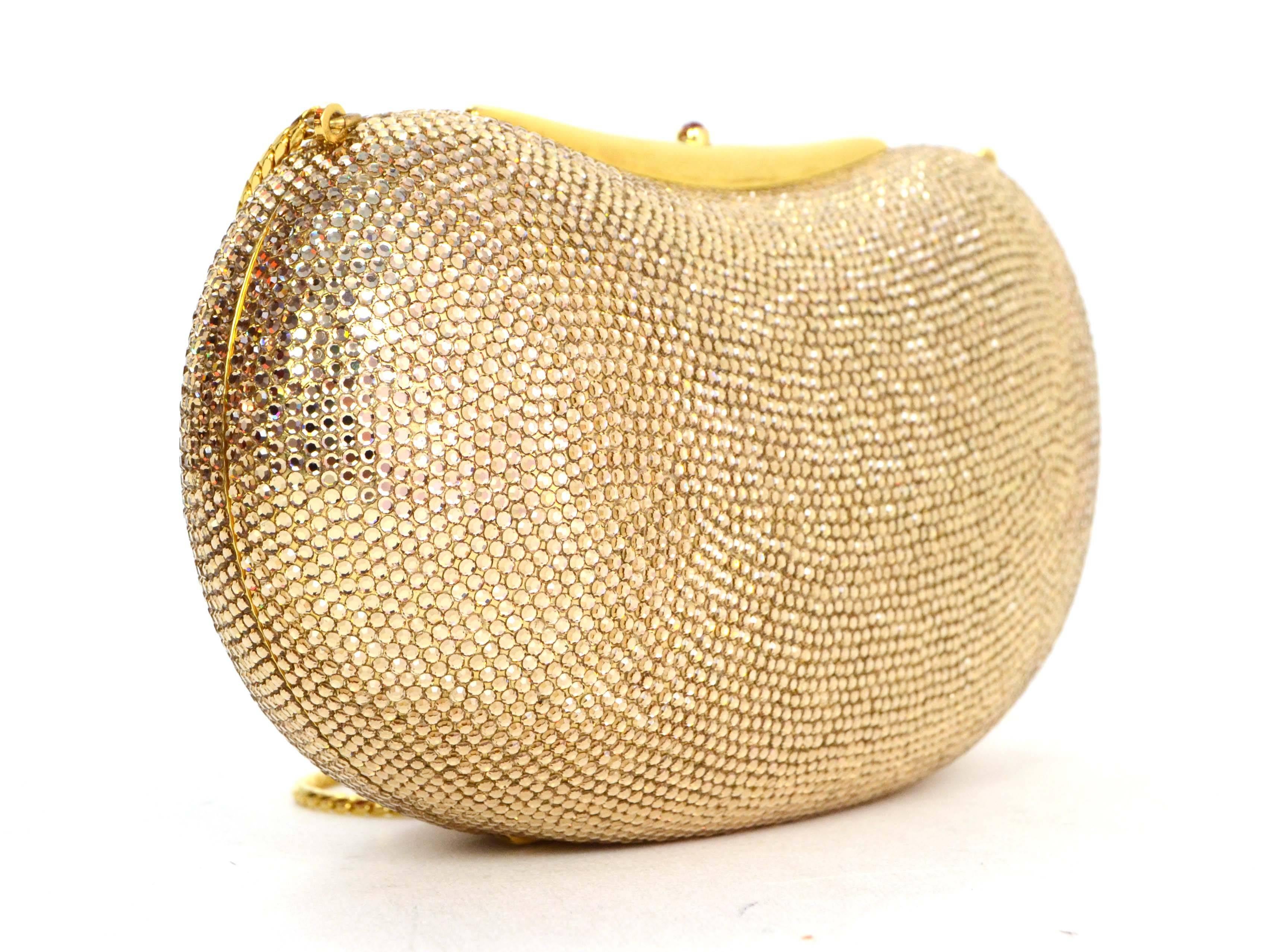 Judith Leiber Bronze Sworovski Crystal Bean Clutch 
Features optional thin goldtone chain strap
Color: Bronze and goldtone
Hardware: Goldtone
Materials: Sworovski crystals and metal
Lining: Metallic gold leather
Closure/Opening: Hinge opening with