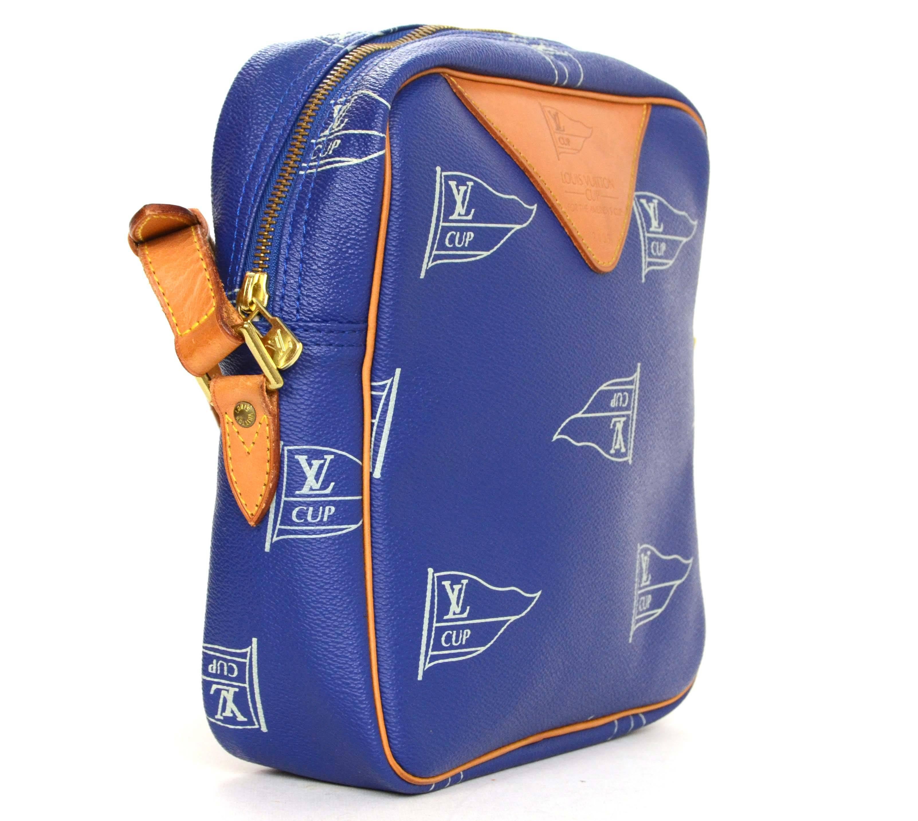 Louis Vuitton Ltd Ed Vintage ’92 Blue “LV Cup” Crossbody Bag
Features “Louis Vuitton Cup For The America’s Cup 2405” stamped on front of bag
Made In: France
Year of Production: 1992
Color: Blue, white, tan and goldtone
Hardware:
