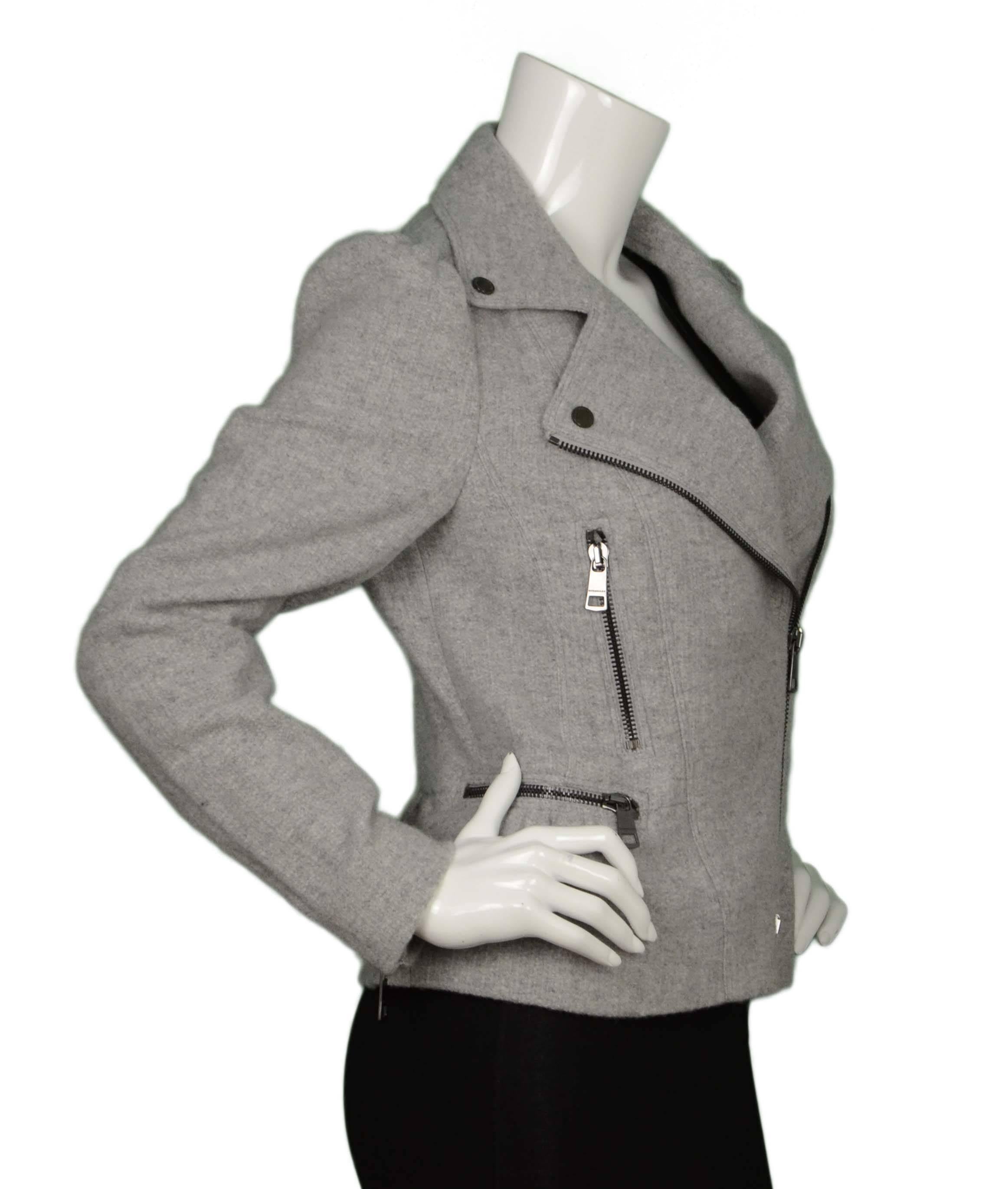 Burberry Grey Wool Peplum Moto Jacket 
Features puffed shoulders and peplum botton
Made In: Poland
Color: Light grey
Composition: Believed to be 100% wool
Lining: None
Closure/Opening: Front asymmetrical zip up with top snaps
Exterior