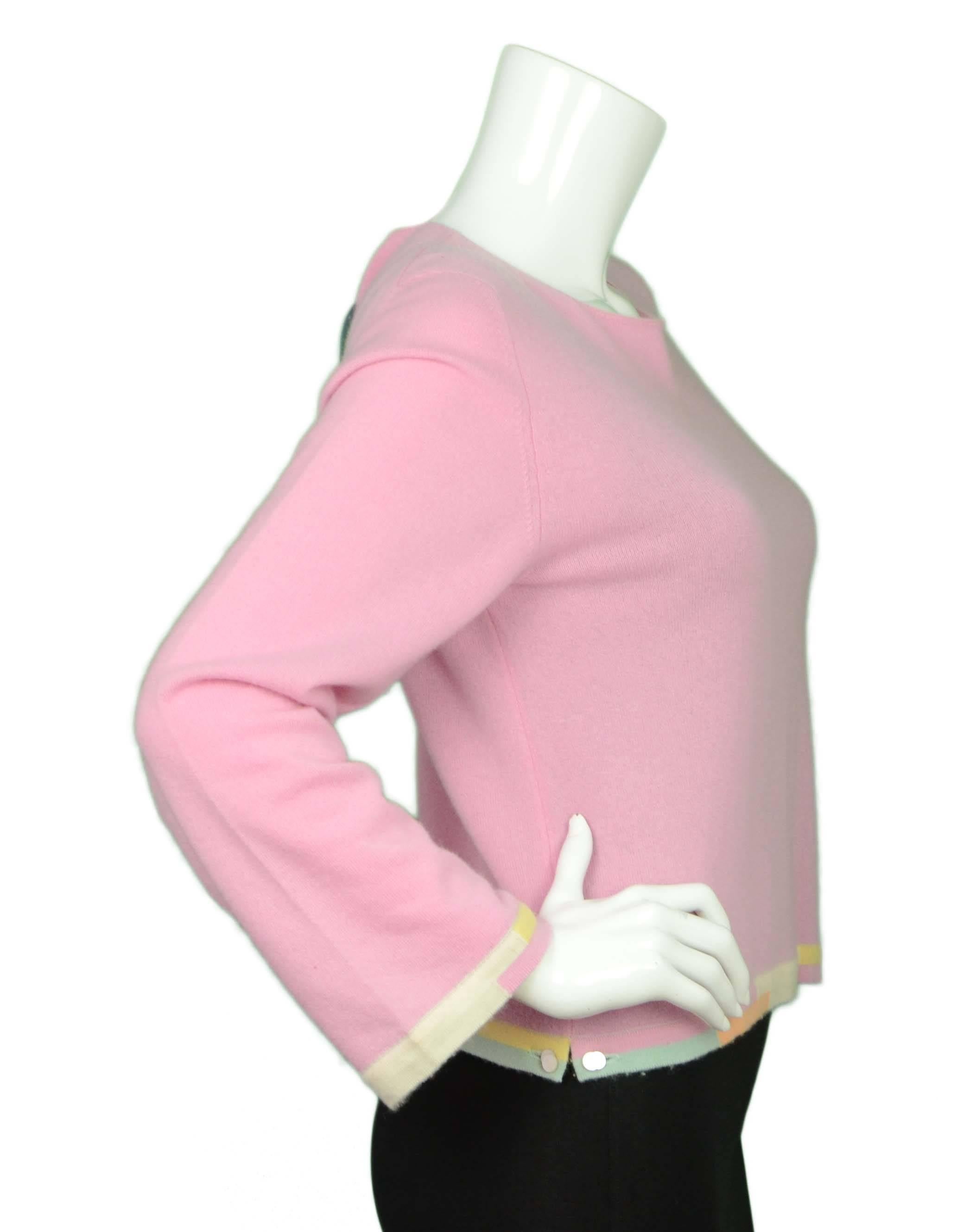 Chanel Vintage ’99 Pink Cashmere Sweater 
Features color blocking and pearl buttons at hemline
Made In: UK
Year of Production: 1999
Color: Pink, yellow, ivory, green and orange
Composition: 100% cashmere
Lining: None
Closure/Opening: Pull on