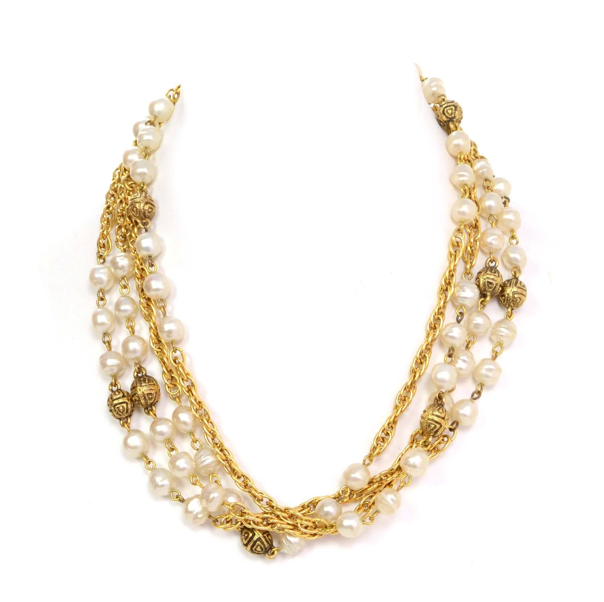 Chanel Vintage '90s Pearl & Gold Bead Long Necklace 
Features large CC pendant at closure
Made In: France
Year of Production: 1990s
Color: Goldtone and ivory
Materials: Metal and faux pearls
Closure: Antique style jewelry closure with push