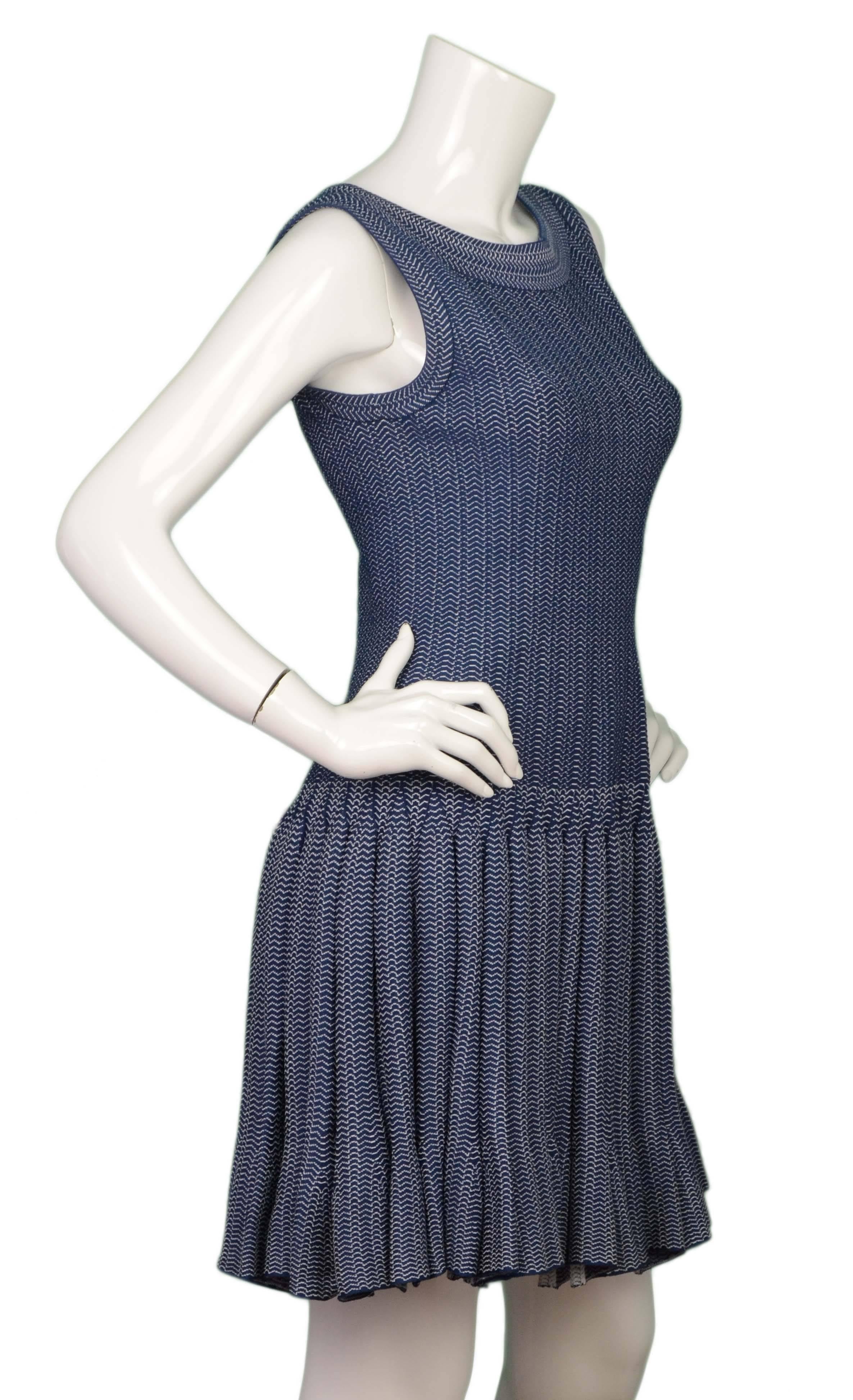 Alaia Blue Sleeveless Fit & Flare Dress 
Features white zig zag print throughout
Made In: Italy
Color: Blue and white
Composition: 75% viscose, 12% nylon, 10% polyester, 3% elastane
Lining: None
Closure/Opening: Back center zip up and hook
