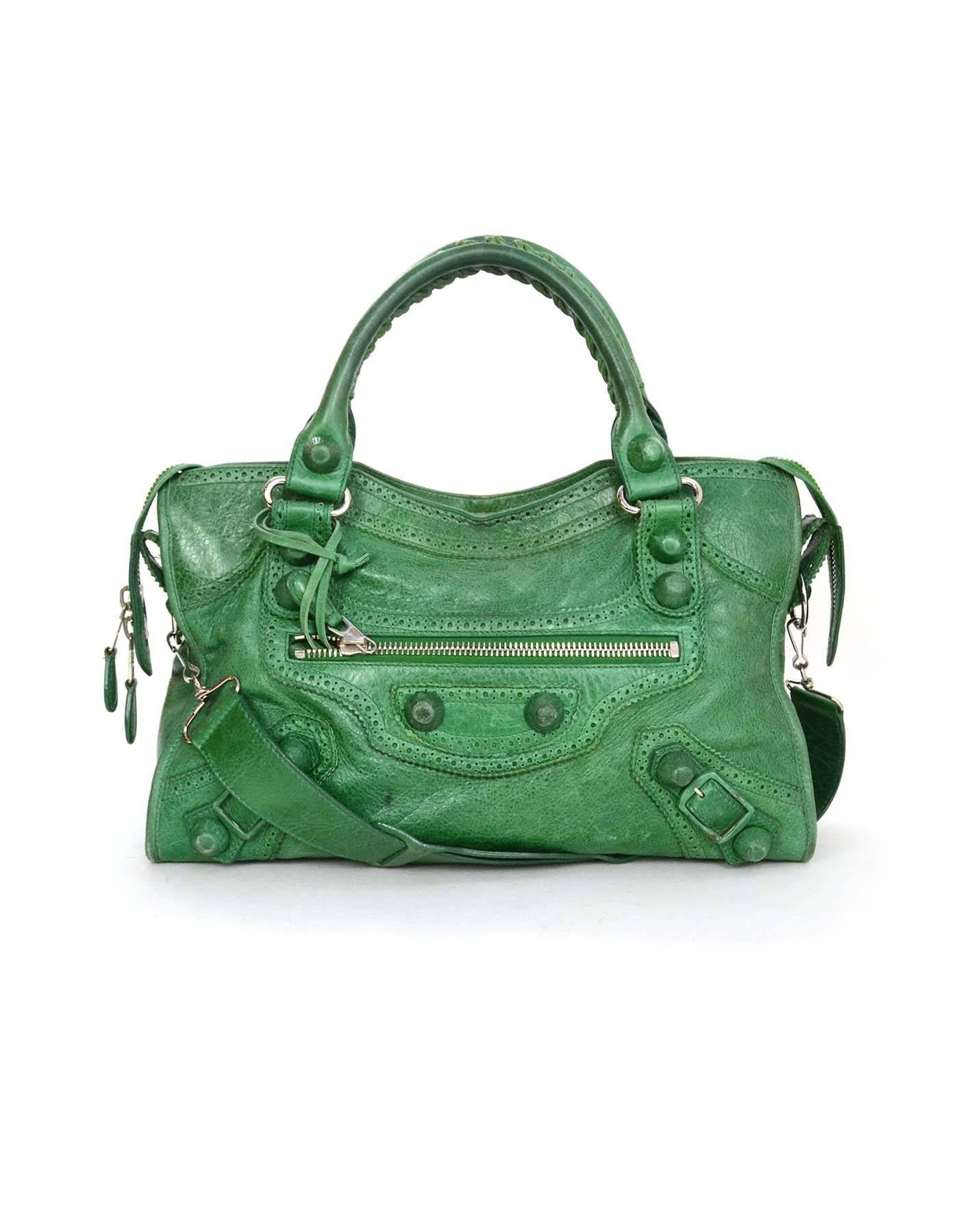 Balenciaga Green Leather Giant Brogues Covered Motorcycle City Bag
Features a detachable shoulder strap

    Made In: Italy

    Color: Green

    Hardware: Silvertone

    Materials: Leather, Metal

    Lining: Black cotton blend