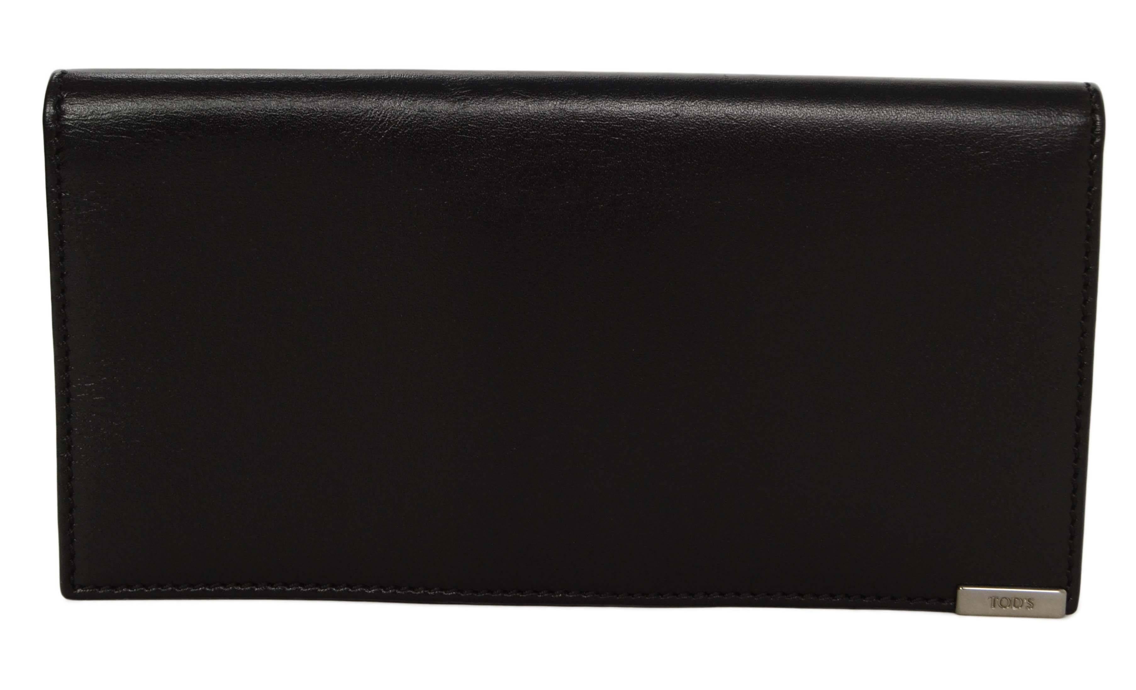 Tod's Black Leather Long Open Wallet 
Features small silvertone plate on back corner with Tod's engraved

Made In: Italy
Color: Black
Hardware: None
Materials: Leather
Closure/Opening: Bi-fold
Exterior Pockets: None
Interior Pockets: One