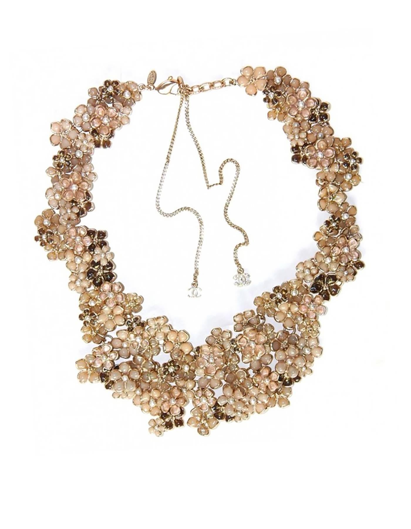 Chanel Beige Pague Camellia Bib Necklace 
Features intricate glass flowers with pearl center layerd on top of each other

Made In: France
Year of Production: 2010
Color: Beige, nude, champagne, pink, gold
Materials: Glass beads and