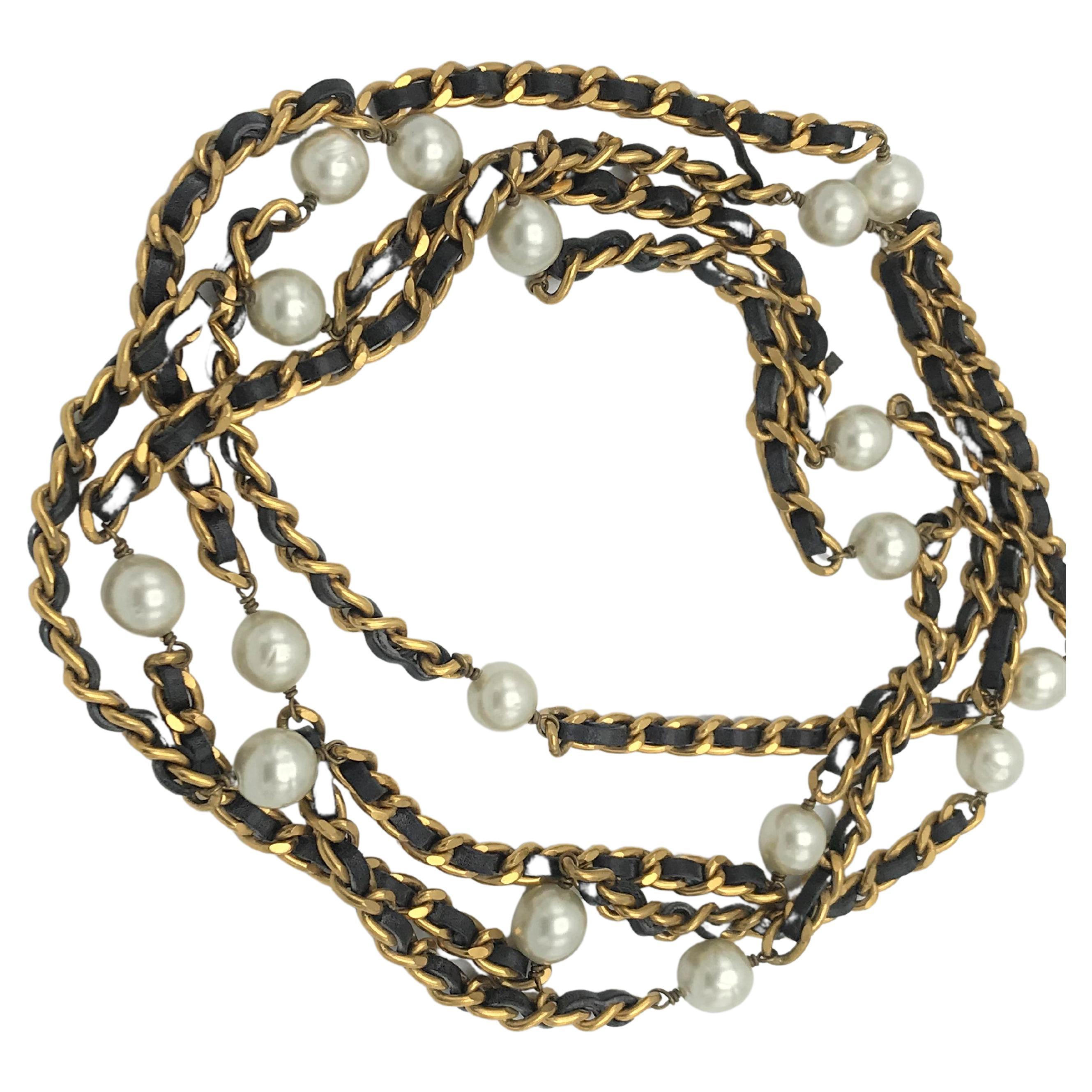 Iconic Chanel chain with leather woven throughout and Chanel pearls, 1990s
