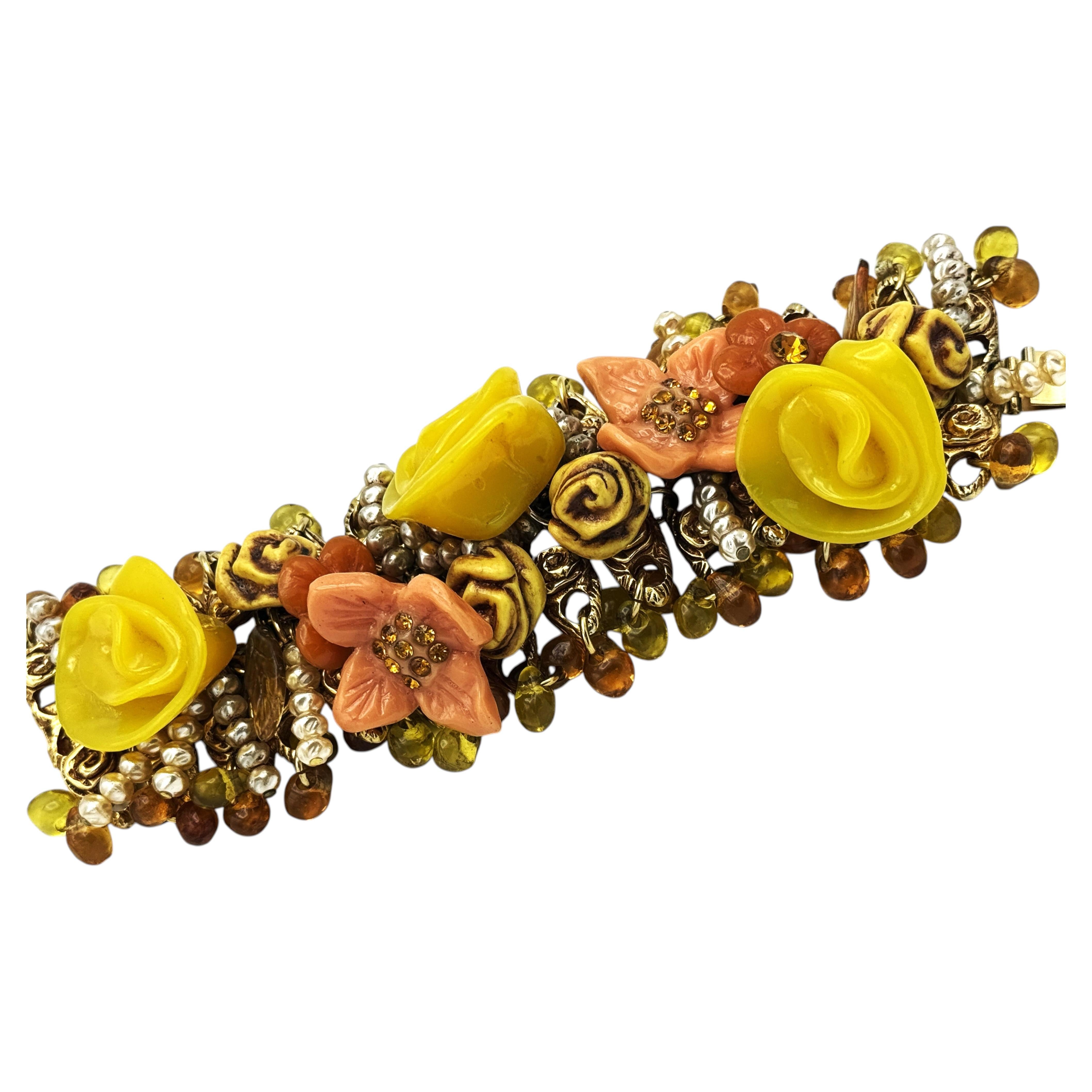 Bracelet by Kalinger Paris, with many attached motifs, 1980s For Sale